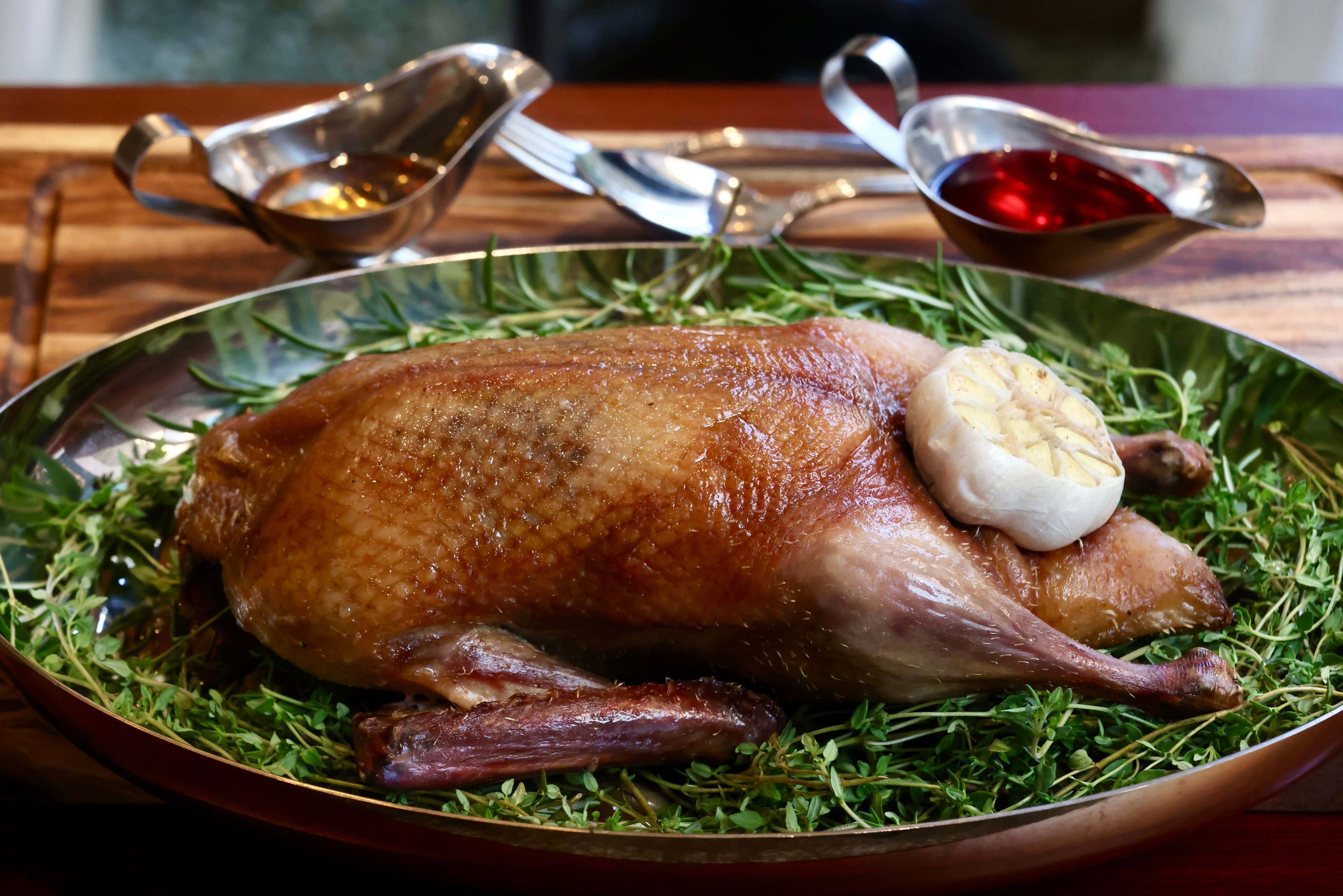 Whole roast dry-aged duck at Le Colvert. Photo: Jonathan Wong