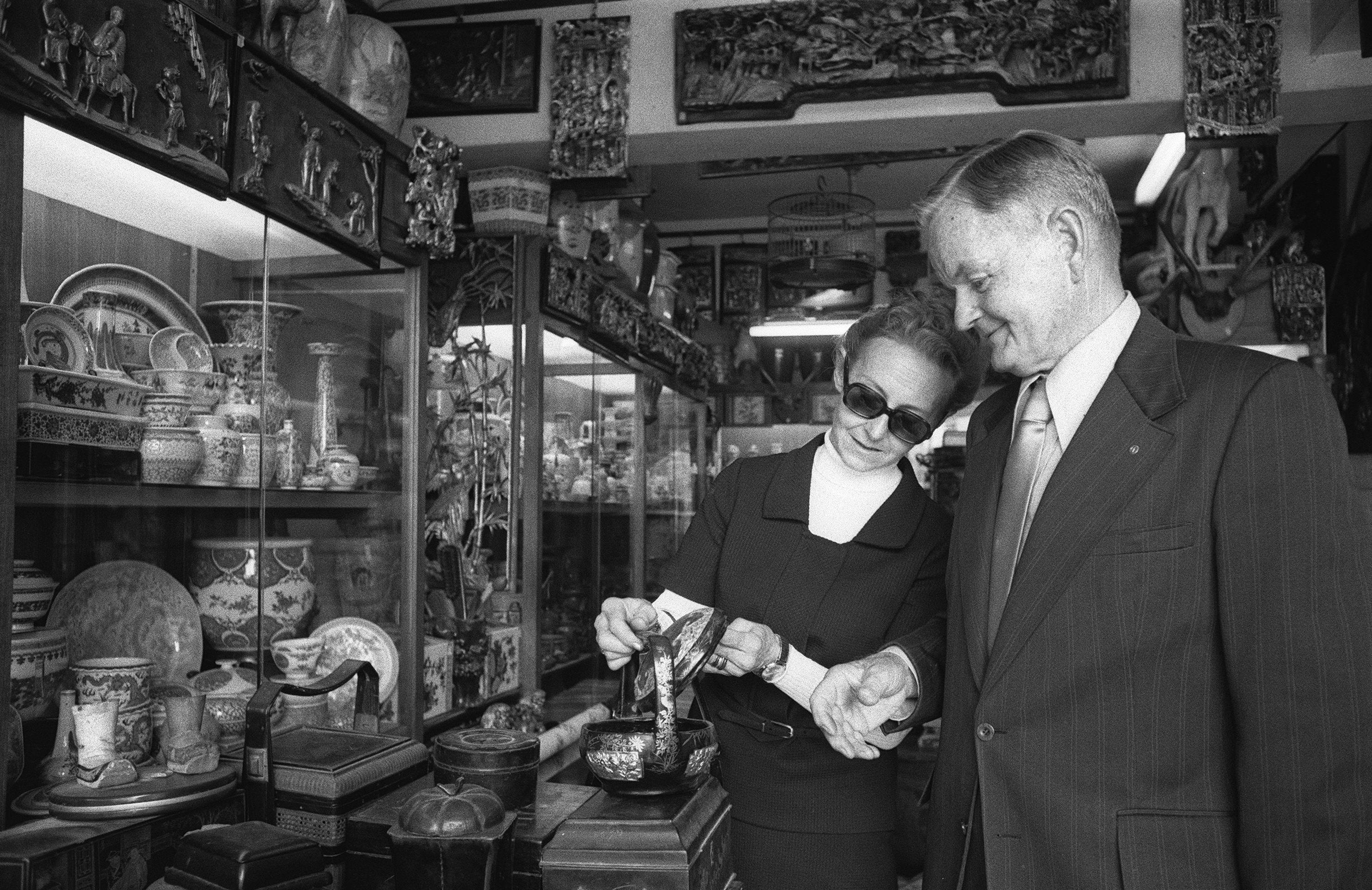 American tourists Mr and Mrs Murray Poston browse the goods on offer at an antique store in Upper Lascar Row in 1976. Photo: SCMP Archives