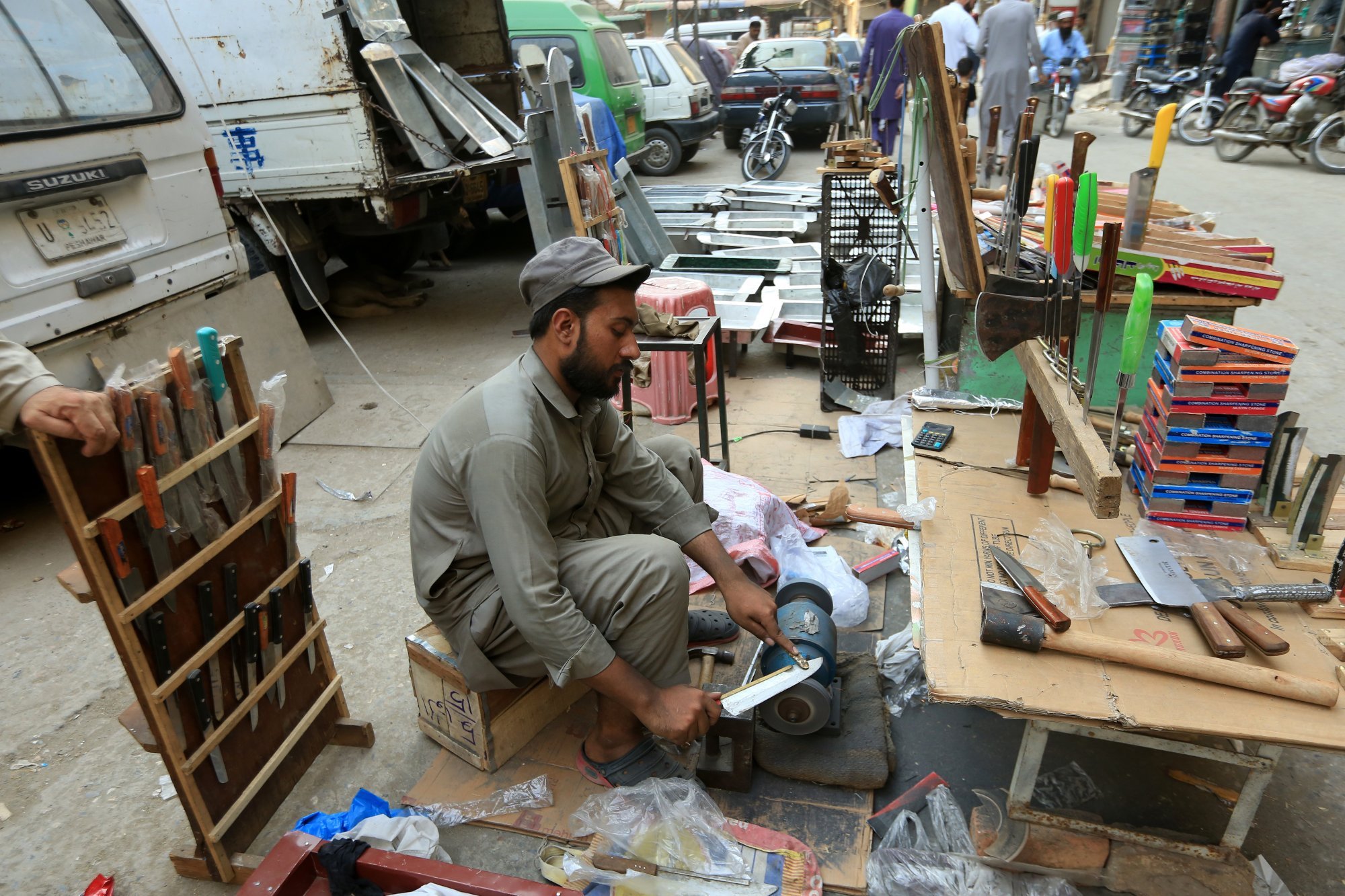 A blacksmith sharpens knives used for cattle slaughtering in Peshawar ahead of the Eid al-Adha holiday. Photo: EPA-EFE A blacksmith sharpens knives used for cattle slaughtering in Peshawar ahead of the Eid al-Adha holiday. Photo: EPA-EFE