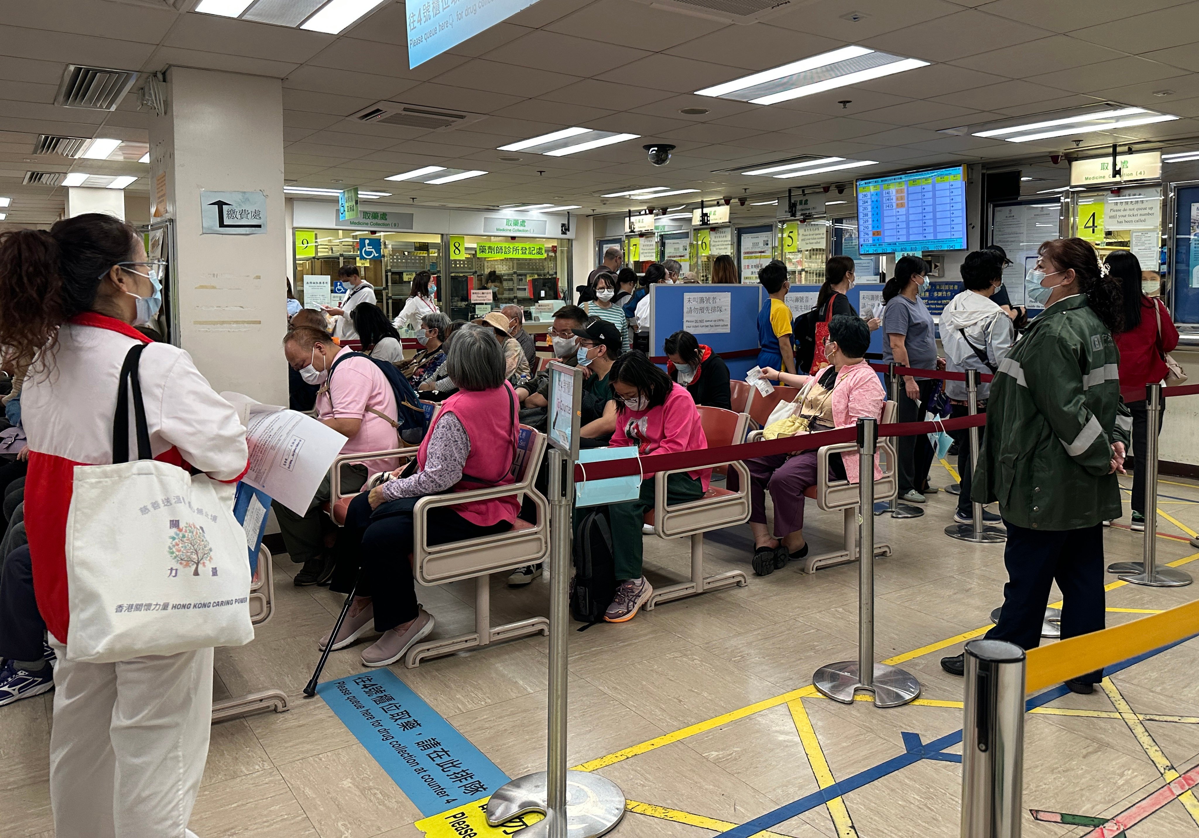 People queue up at the pharmacy of Queen Elizabeth Hospital. Authorities announced a series of measures to reform the subsidisation structure of public healthcare services in March. Photo: Jelly Tse