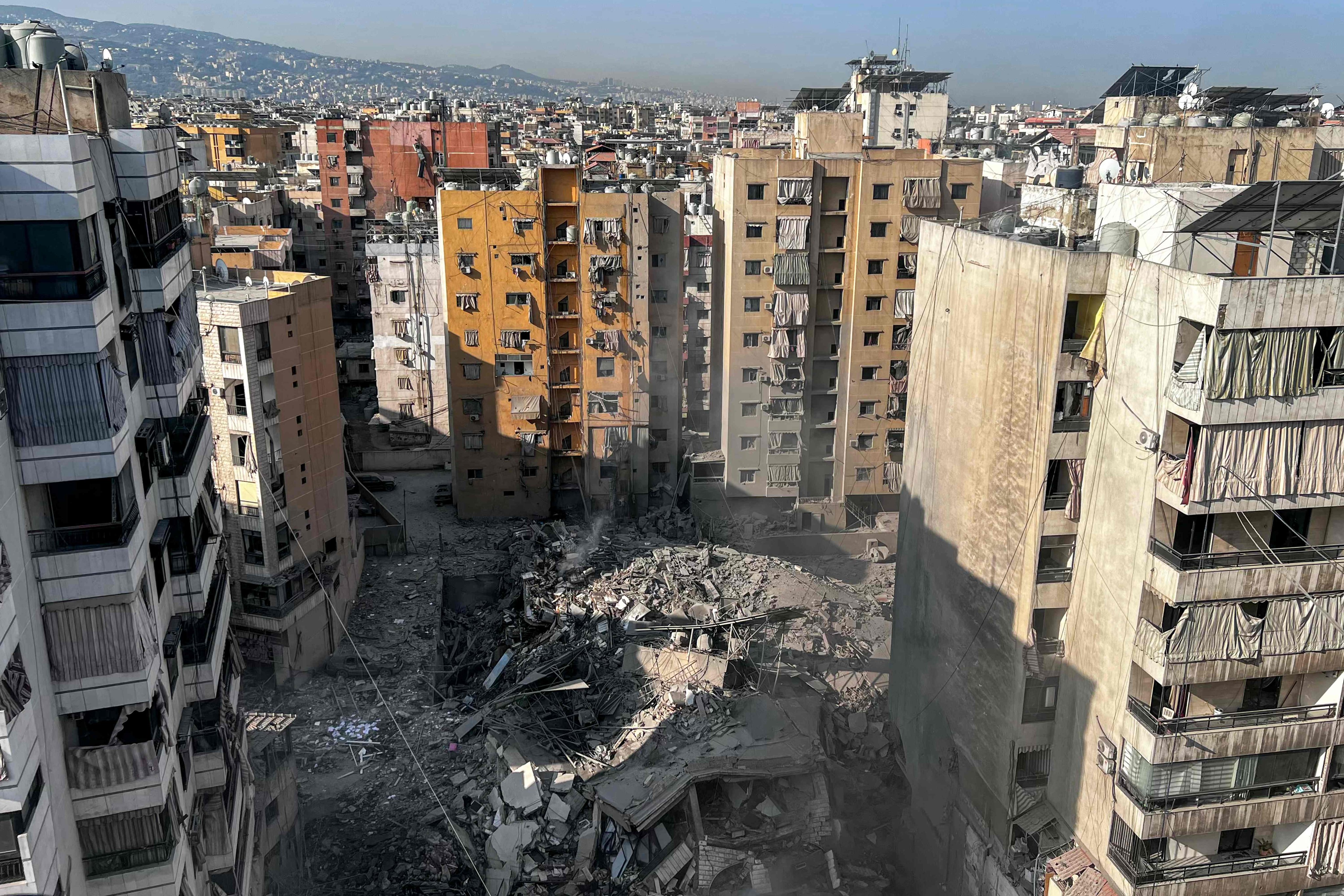 The rubble of a collapsed building hit by an overnight Israeli air strike in the Qaem neighbourhood of Beirut’s southern suburbs. Photo: AFP