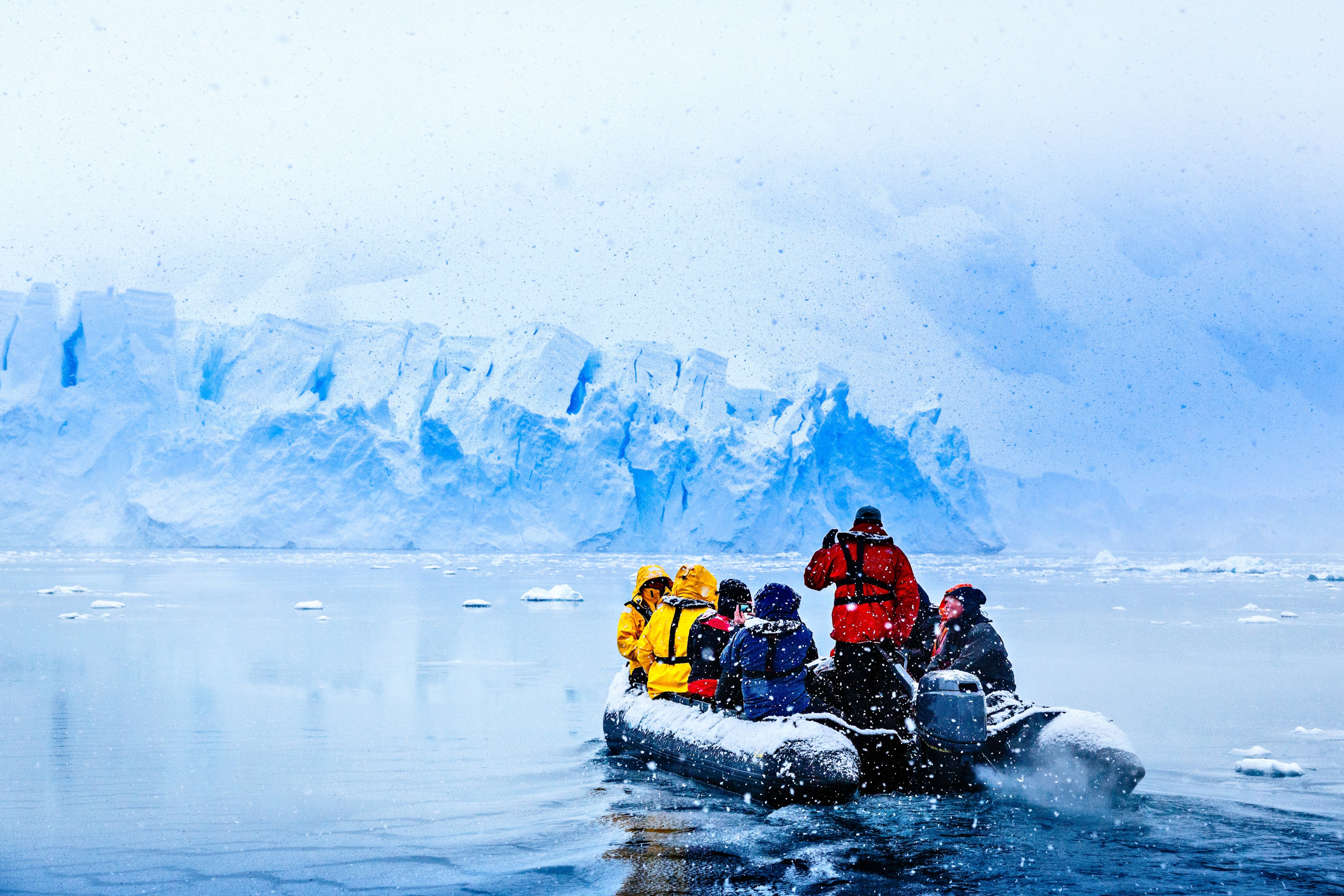 A Zodiac takes tourists up close to a glacier on the Antarctic Peninsula, in the Southern Ocean. Photo: Shutterstock