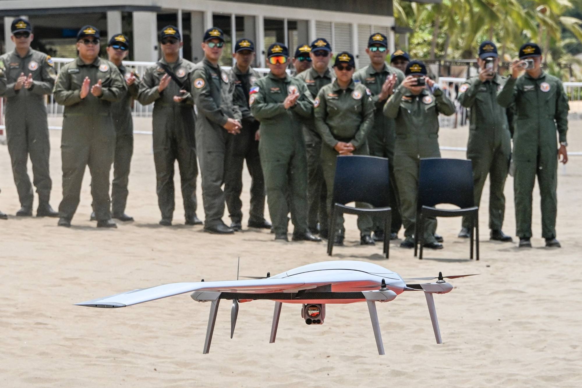 Philippine military personnel observe a drone in Mariveles, Bataan in April. Analysts say there is a need for coordination in drone warfare training across the Philippine military. Photo: AFP Philippine military personnel observe a drone in Mariveles, Bataan in April. Analysts say there is a need for coordination in drone warfare training across the Philippine military. Photo: AFP
