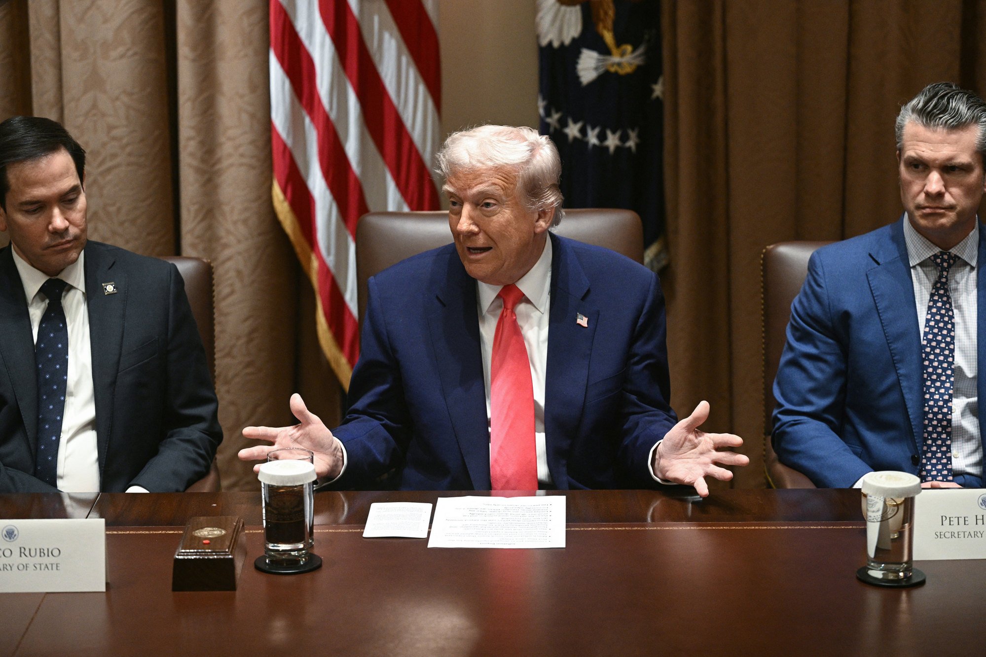 President Donald Trump speaks as Secretary of State Marco Rubio (left) and Defence Secretary Pete Hegseth (right) look on during a cabinet meeting in the White House. Photo: TNS President Donald Trump speaks as Secretary of State Marco Rubio (left) and Defence Secretary Pete Hegseth (right) look on during a cabinet meeting in the White House. Photo: TNS