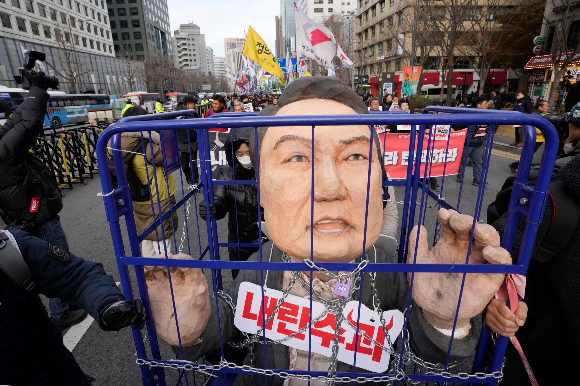 Protesters carry a caricature of former South Korean president Yoon Suk-yeol after a rally in Seoul last year demanding his impeachment. Photo: AP Protesters carry a caricature of former South Korean president Yoon Suk-yeol after a rally in Seoul last year demanding his impeachment. Photo: AP