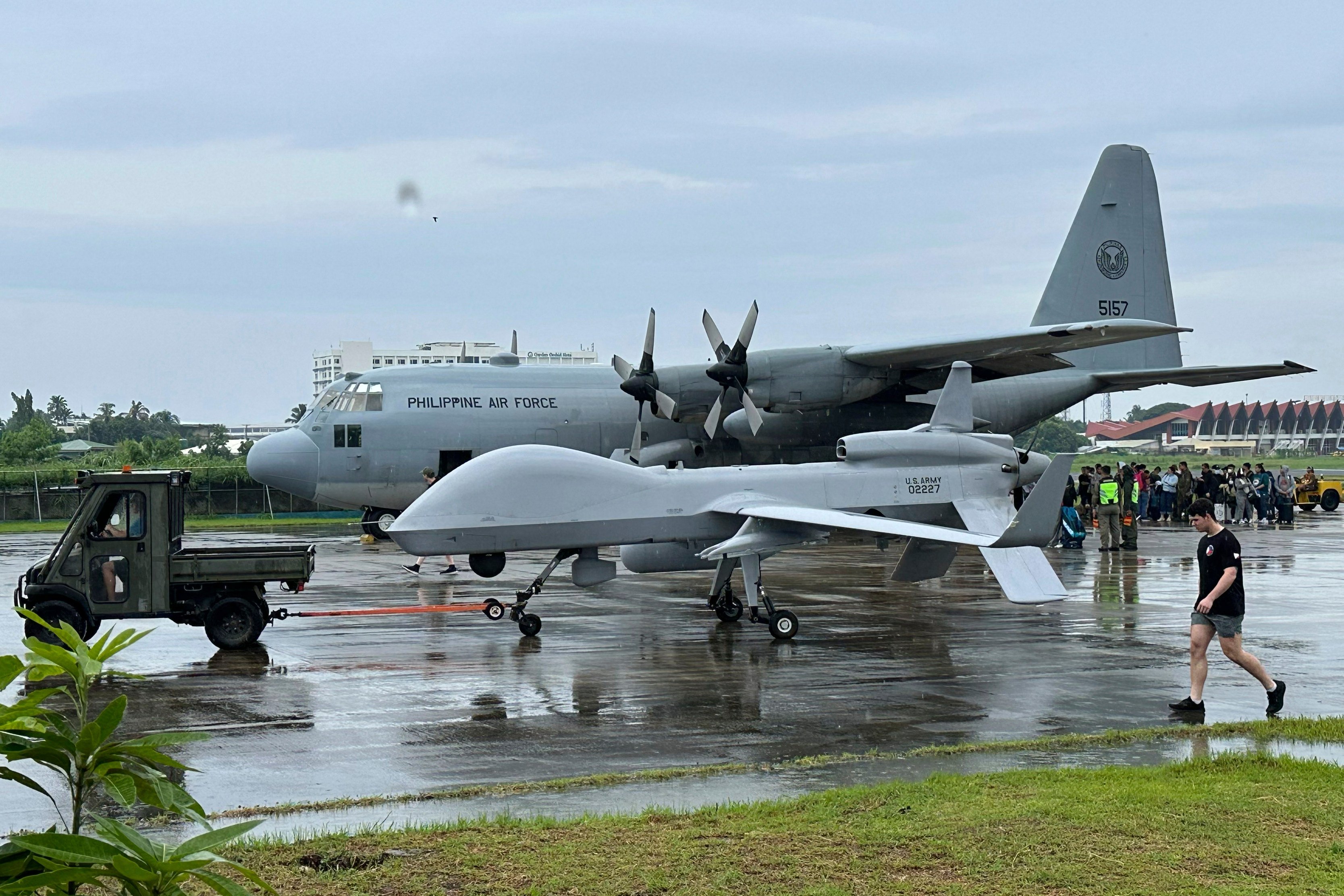 A US navy drone positioned beside a Philippine C130 plane at the airport of Zamboanga, southern Philippines on Tuesday. Photo: AP