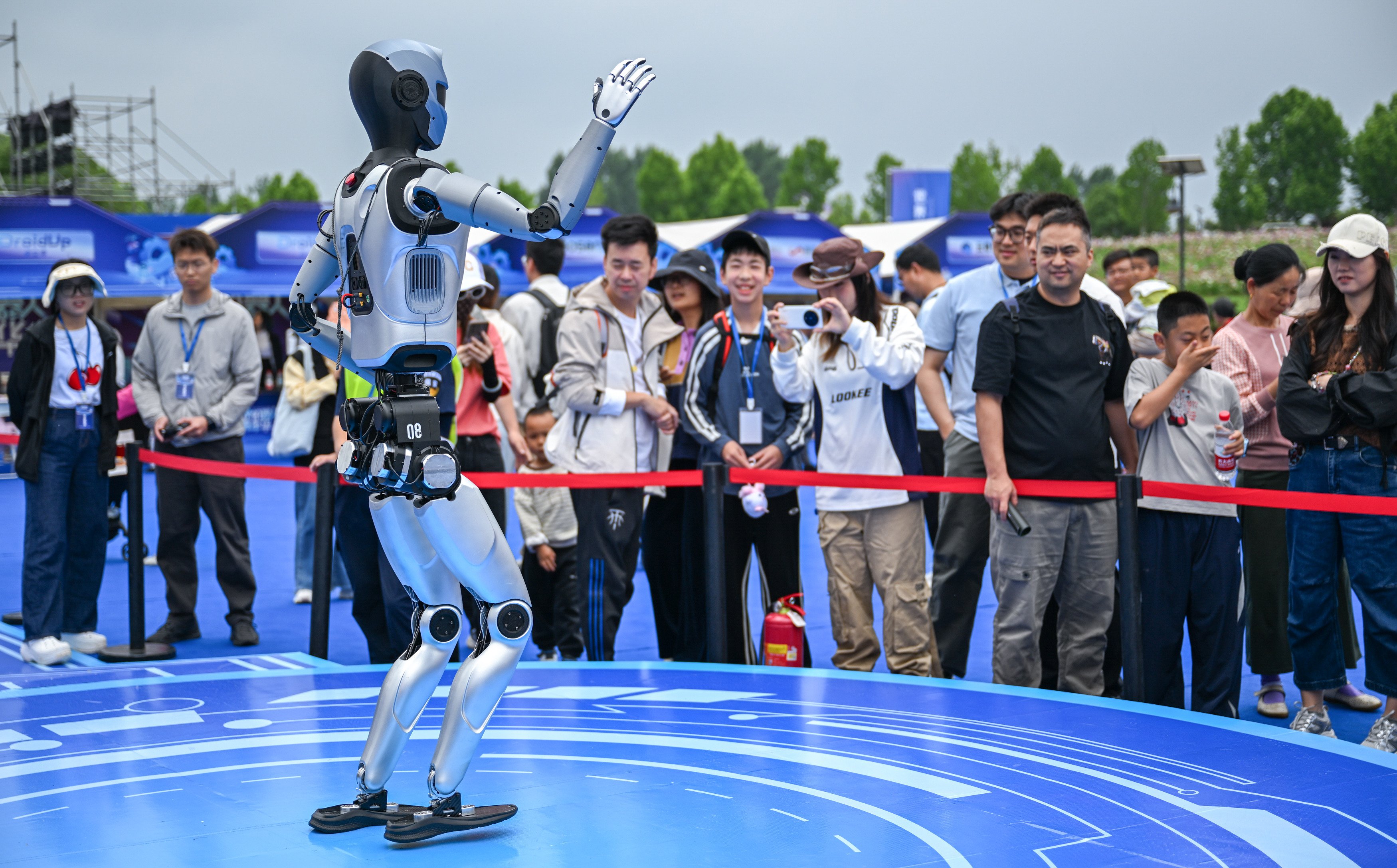 Visitors watch a robot performing during the world robot carnival in Wuhan this week. Photo: Xinhua