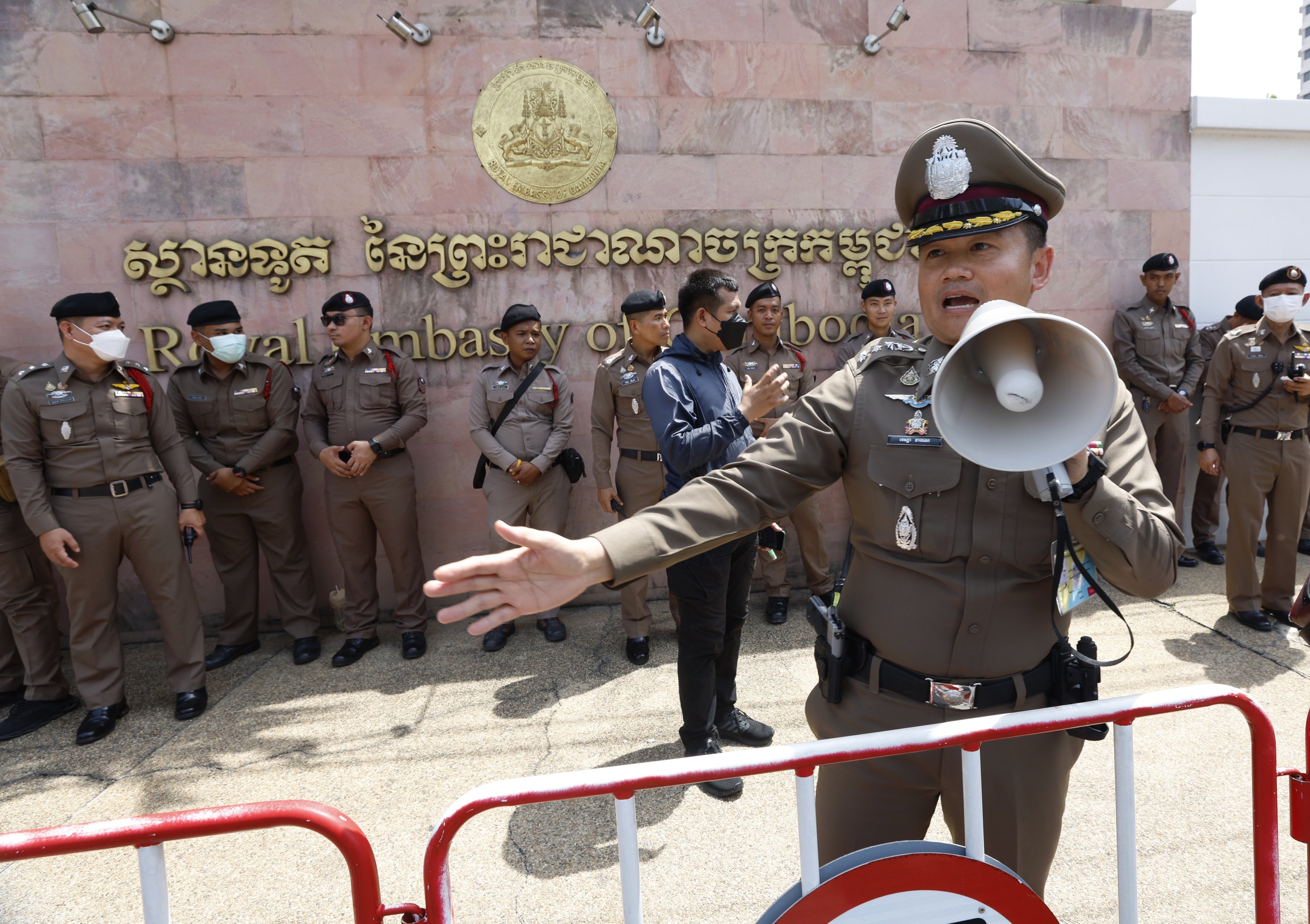 Thai police officers control the area outside the Cambodian Embassy as the nationalist gather to protest over the Thai-Cambodian border dispute, in Bangkok, Thailand on Friday. Photo: EPA-EFE