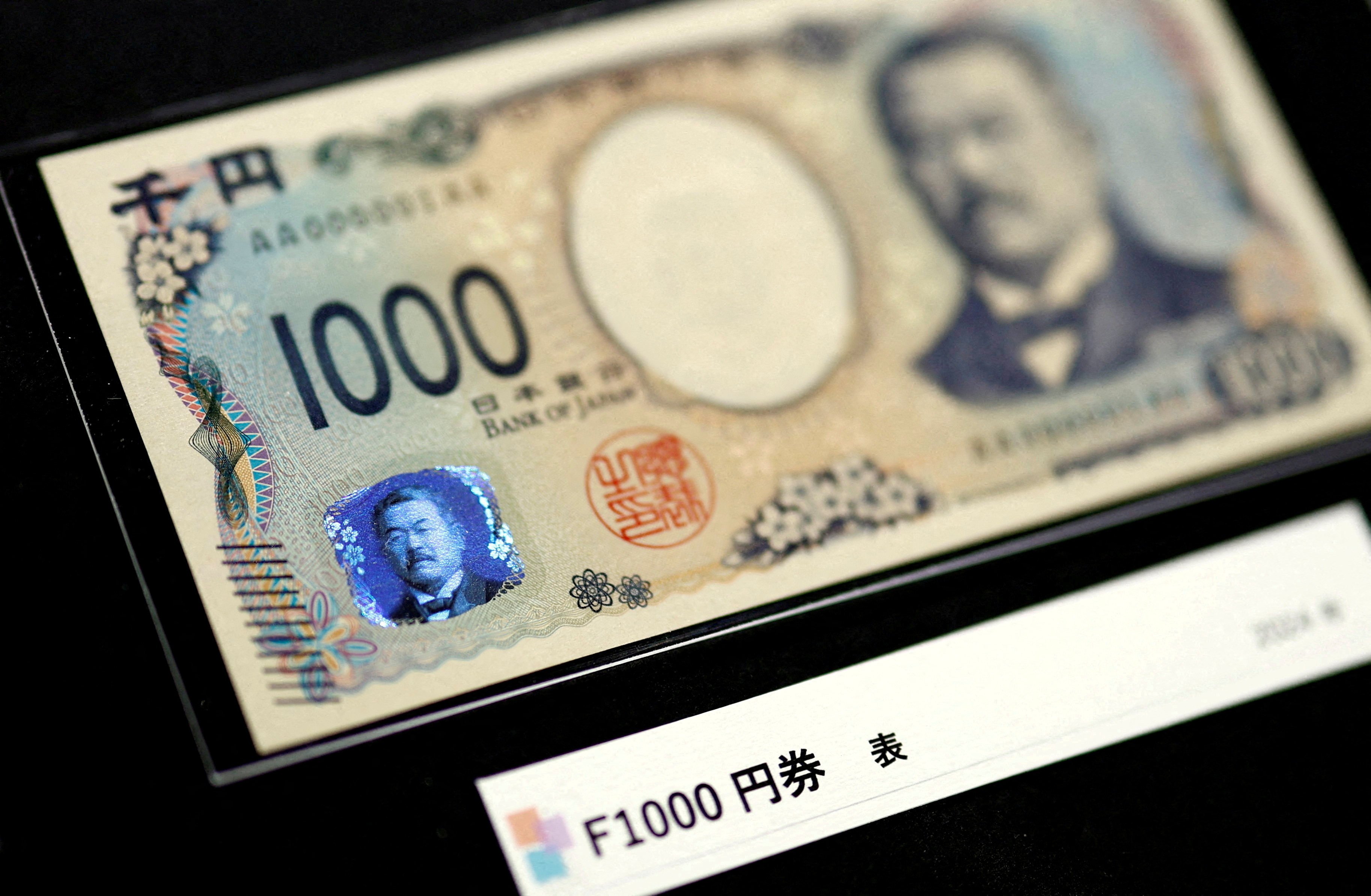Holograms are displayed on the new Japanese 1,000 yen banknote, at a currency museum of the Bank of Japan, in Tokyo, Japan, on July 3 last year. Photo: Reuters