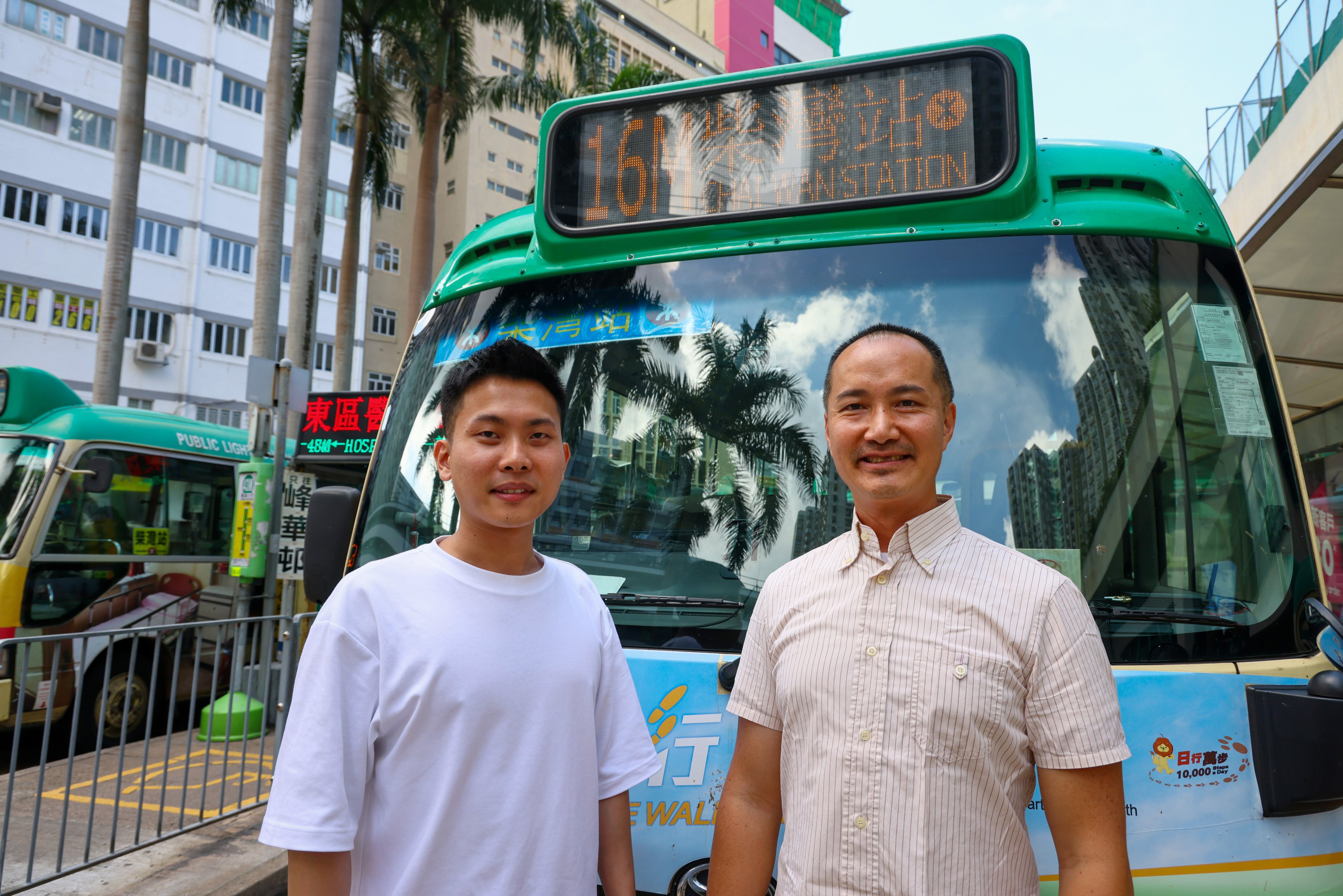 Minibus driver Yin Wang (left), stands alongside Ka Wo Motors manager Lee Pak-kay. The driver is among those brought in under a labour import scheme. Photo: Dickson Lee