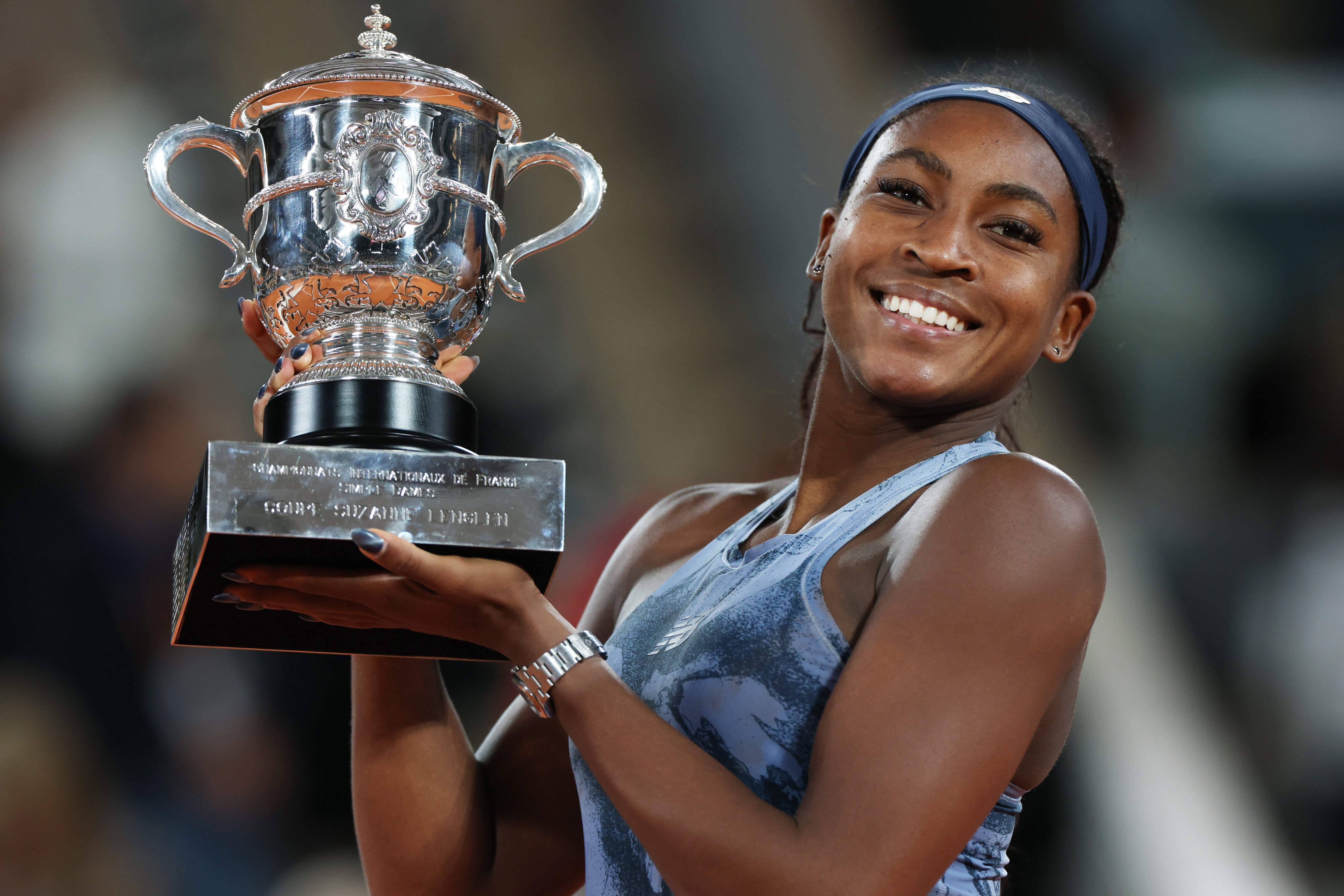 Coco Gauff holds up the French Open trophy after winning her second grand slam title against Aryna Sabalenka at Roland Garros, Paris on Saturday. Photo: Xinhua