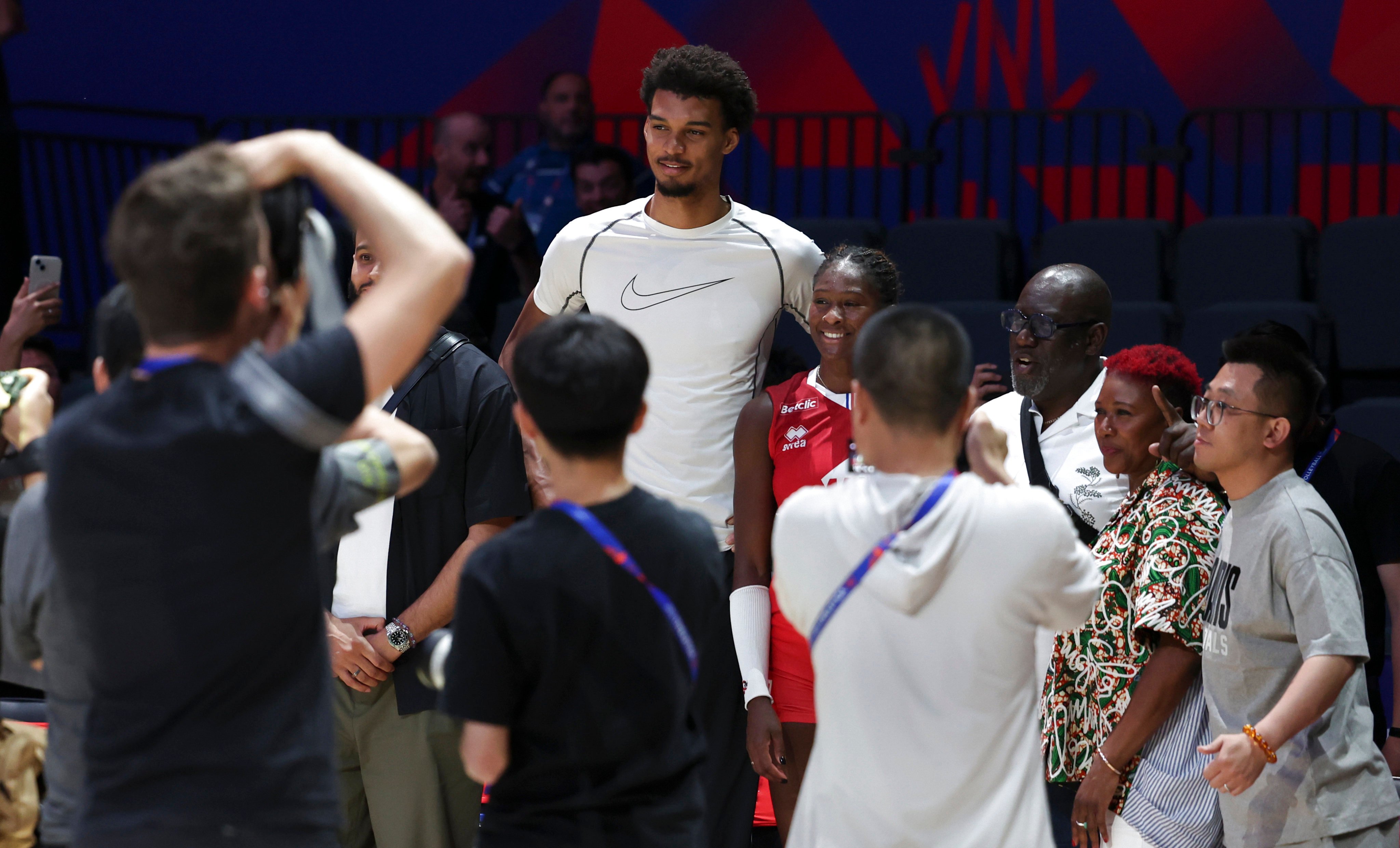 French basketball player Victor Wembanyama poses with France’s Iman Ndiaye after the Pool 3 match between France and Belgium at the Women’s Volleyball Nations League  in Beijing on June 6. Photo: Xinhua