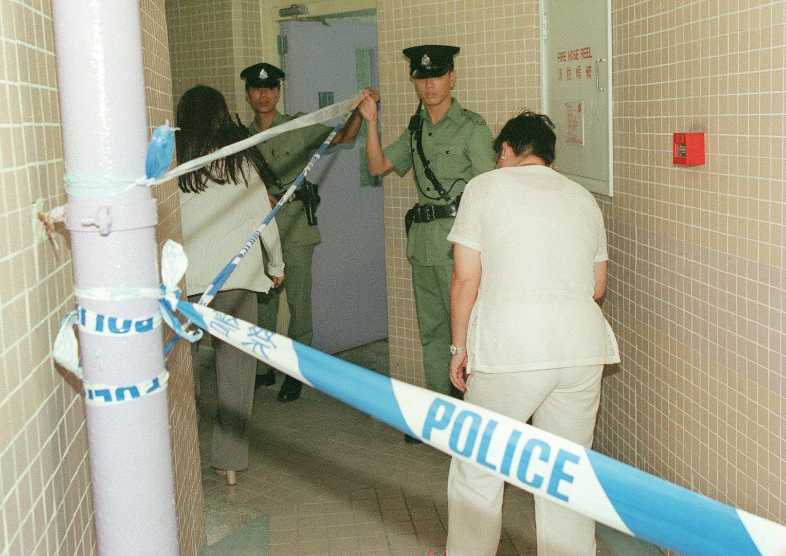 Police mount an investigation at a flat in Tin Shui Wai Estate where the bodies of five people were found after an apparent murder-suicide in 1999. Photo: SCMP Archives
