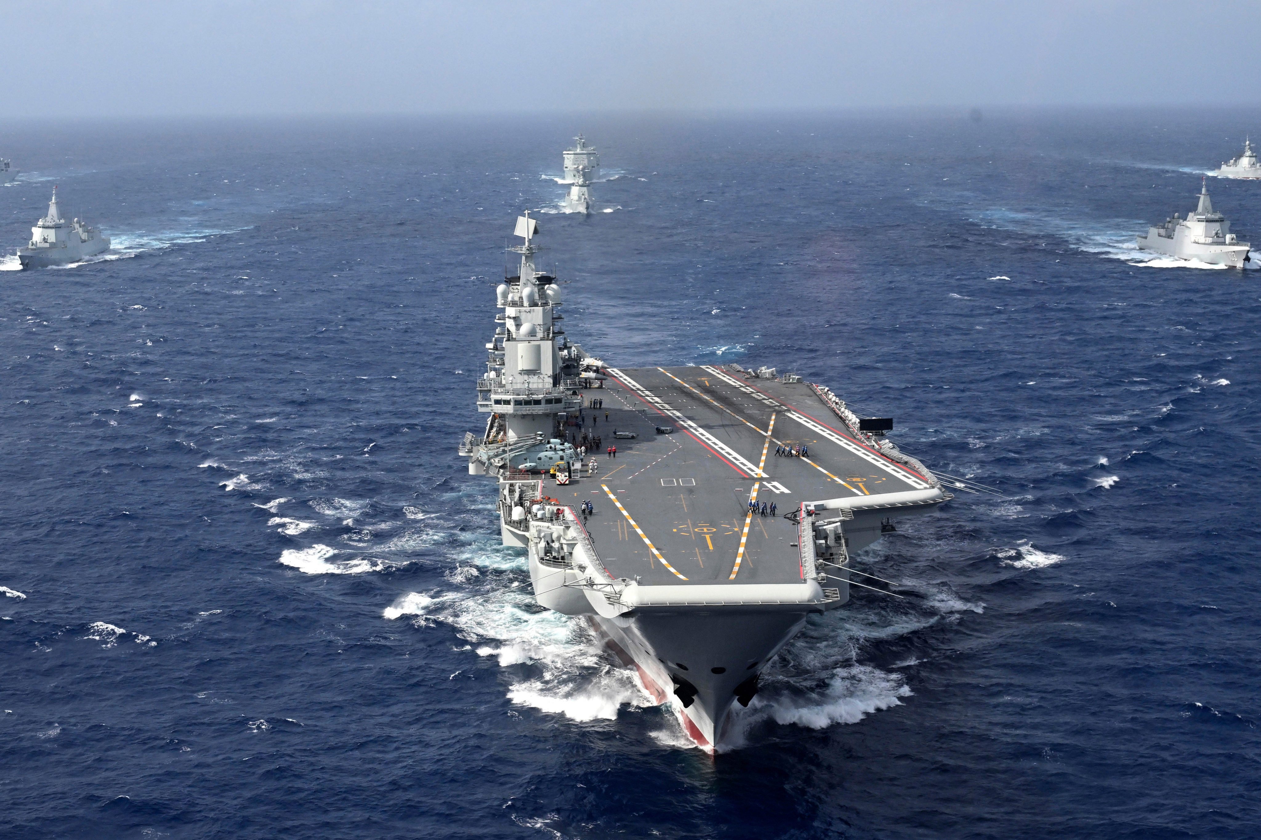 The Chinese aircraft carrier Liaoning and other vessels take part in a drill in the South China Sea last year. Photo: AP