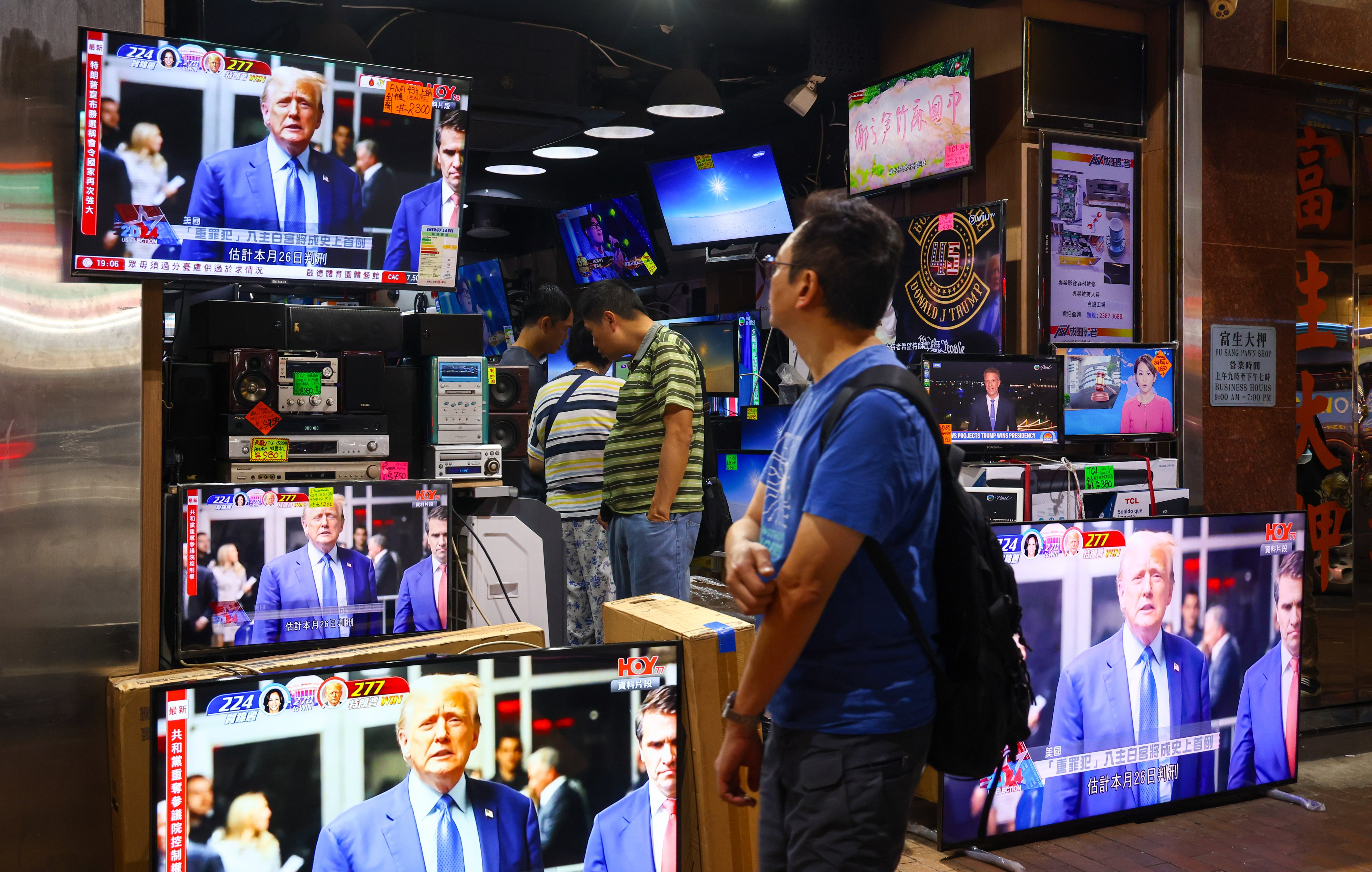 News of Donald Trump winning the US presidential election is broadcast on  TVs in Sham Shui Po last November. In 2023, the government approved easing the cap for non-English programmes on English channels from 20 per cent to 45 per cent. Photo: Dickson Lee