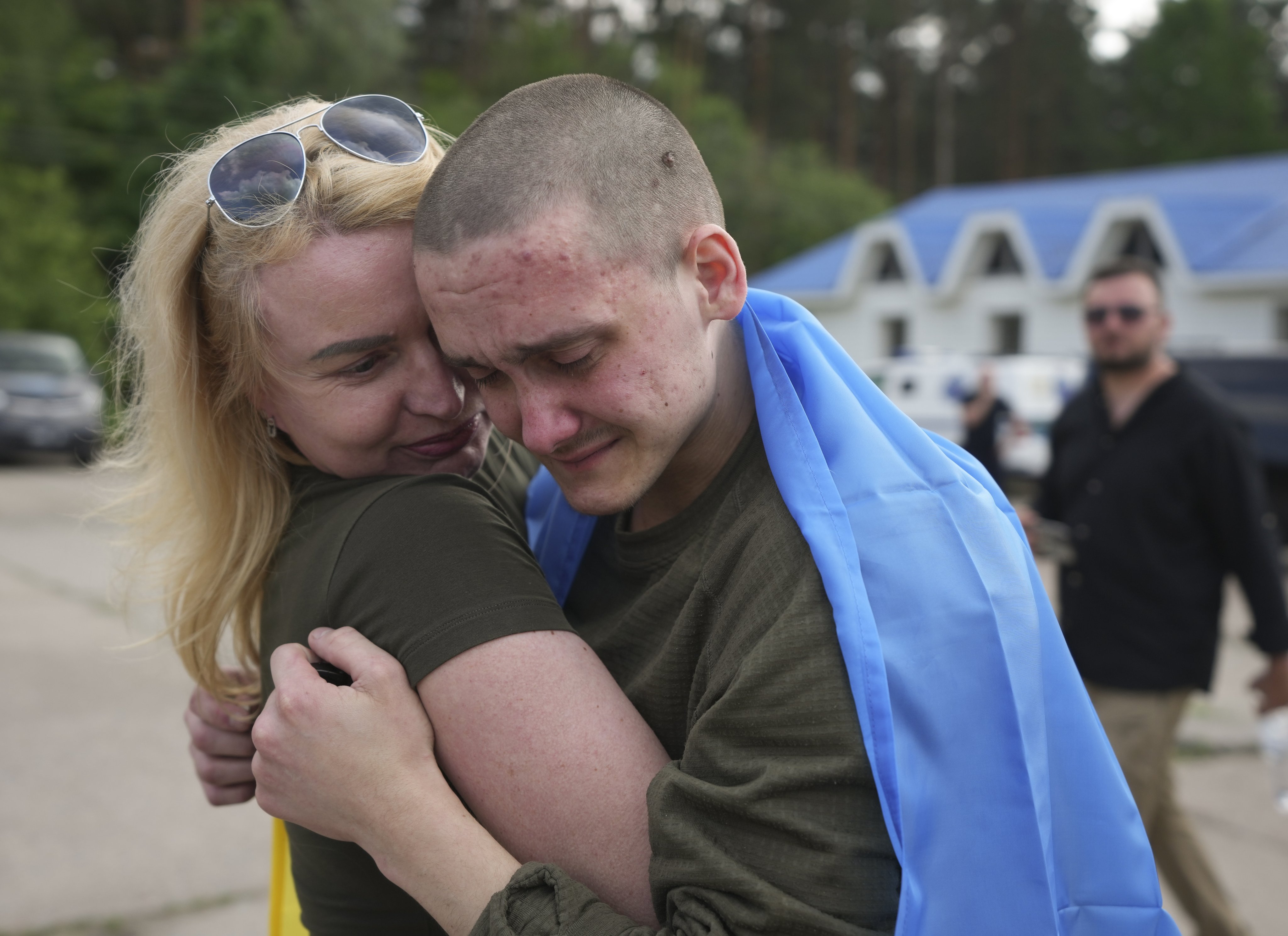 Ukrainian prisoners of war hug after being freed on Monday. Photo: via EPA-EFE