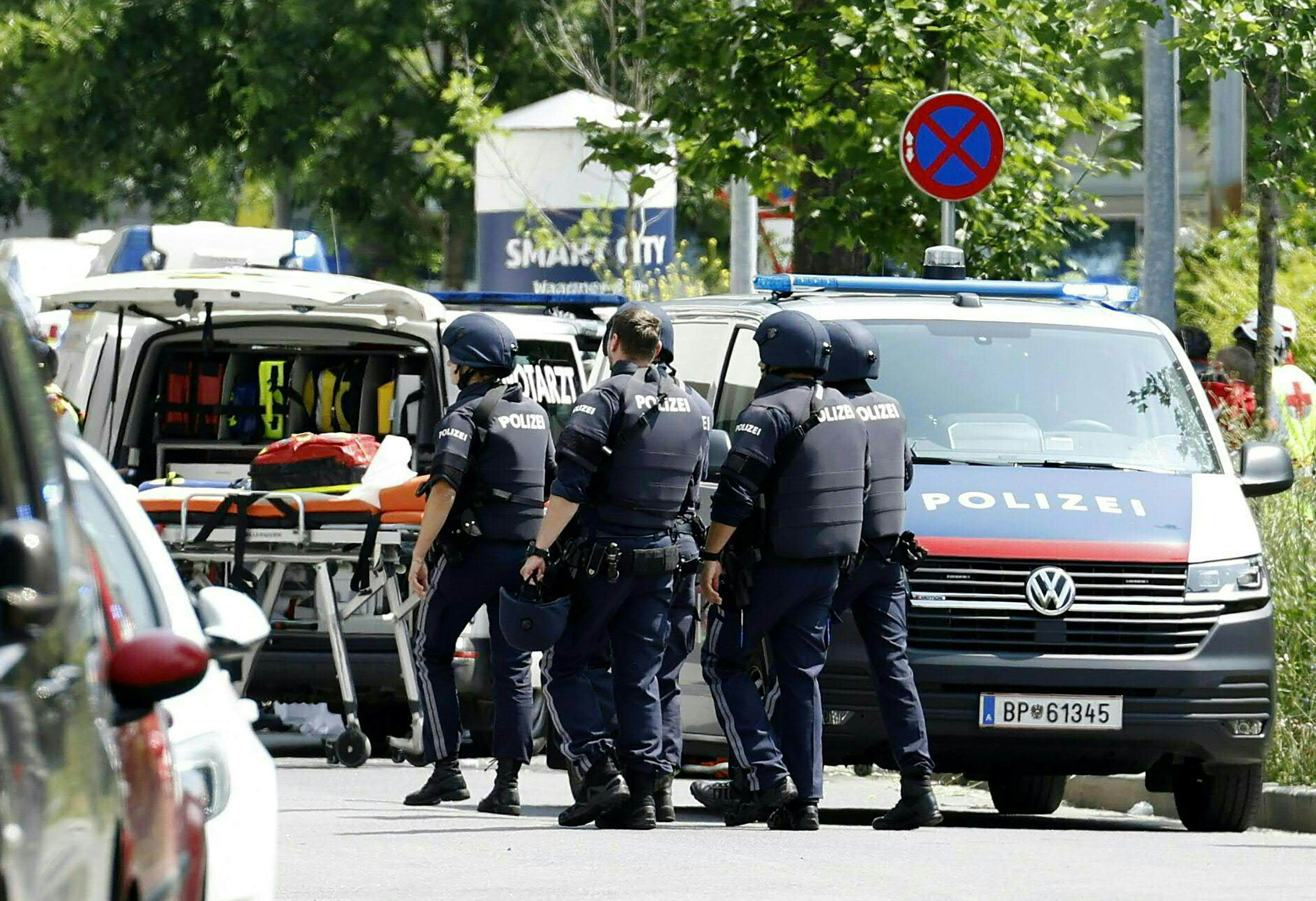 Policemen are seen in a street close to a school where, according to reports, several people died in a shooting, on Tuesday in Graz, Austria. Photo: AFP