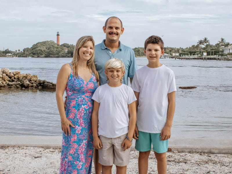 Kandi Schmitz (left) with her husband and two children in 2024. Schmitz had a stroke at 31 while running a 5K race; almost a decade later, she was diagnosed with breast cancer. Photo: Courtesy of Heather Lynn Photography/ American Heart Association