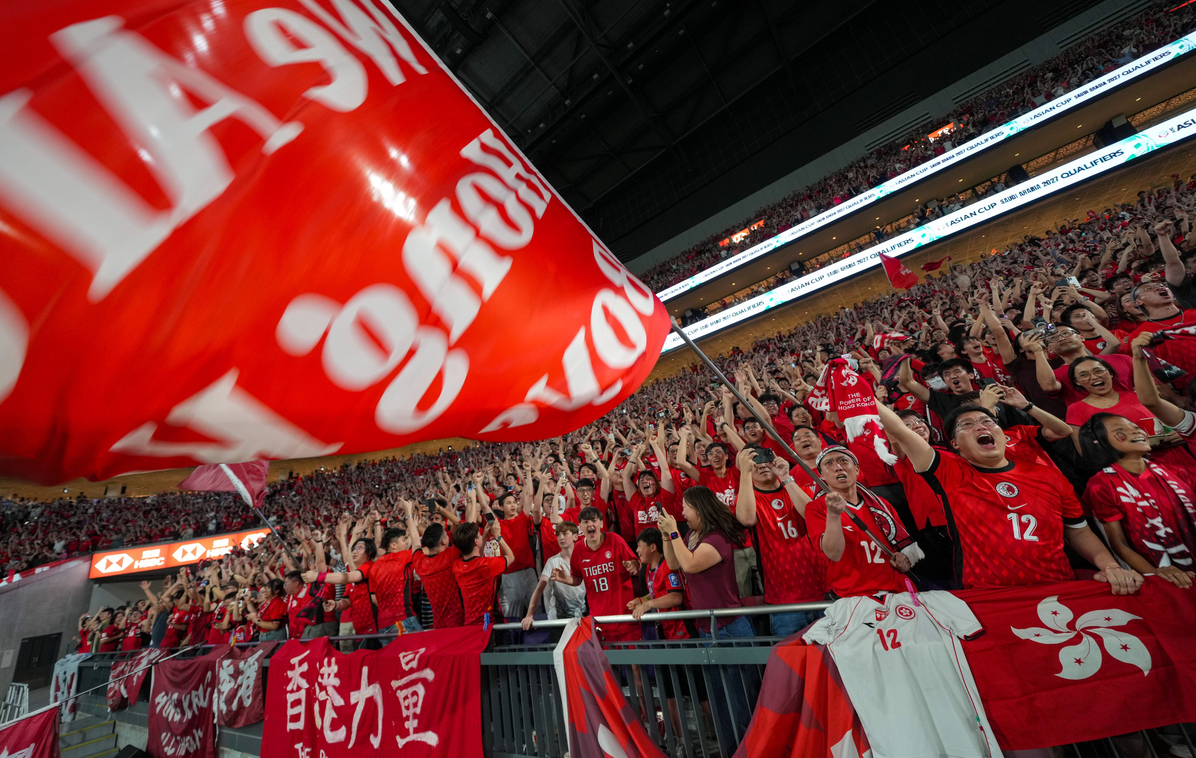 Analysts believe the success of the first Hong Kong football team home game played at Kai Tak stadium highlights an opportunity to develop a sports economy in the city. Photo: Sam Tsang