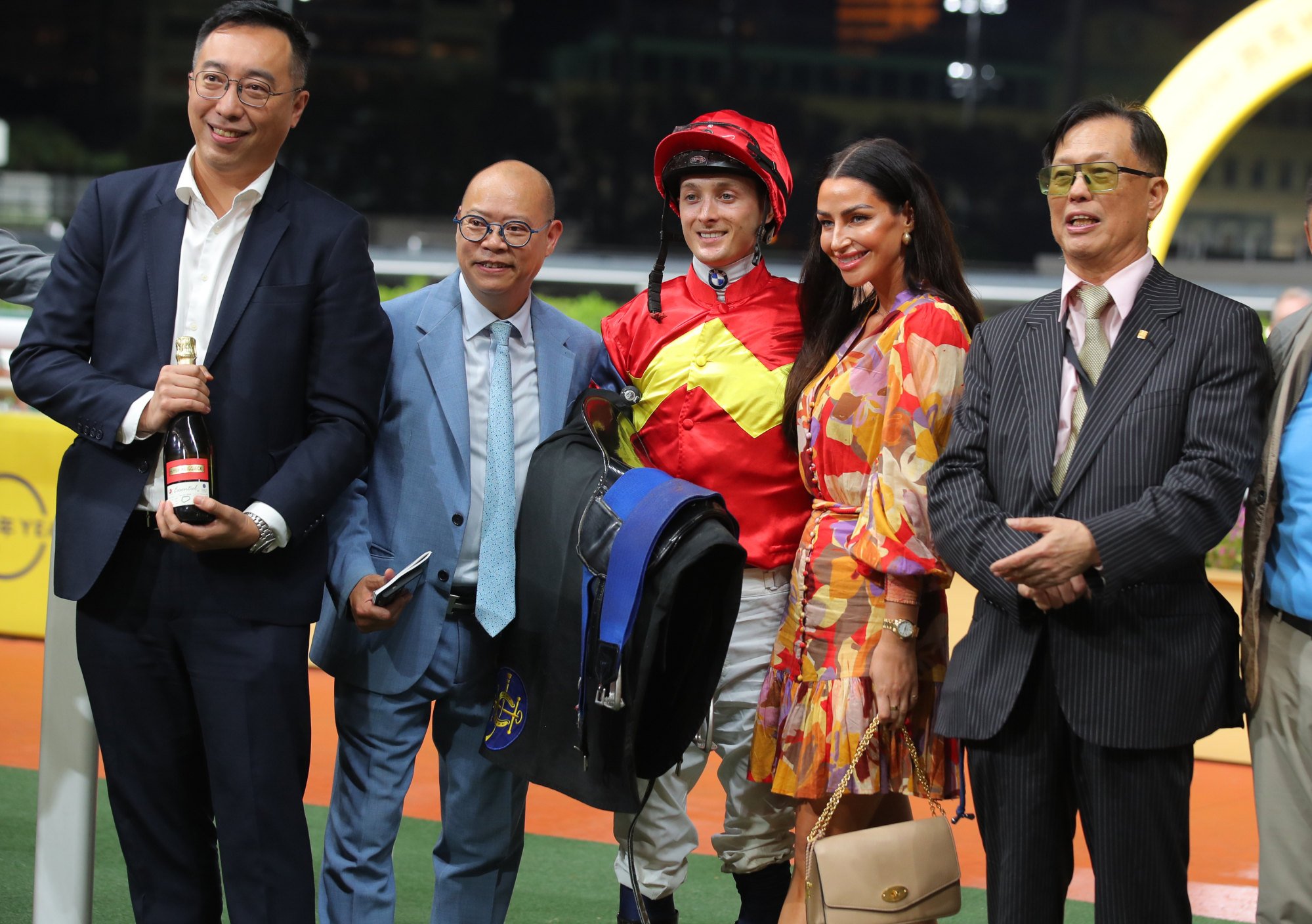 Trainer Chris So (second from left), jockey Harry Bentley (centre) and connections of Hong Lok Golf celebrate. Trainer Chris So (second from left), jockey Harry Bentley (centre) and connections of Hong Lok Golf celebrate.