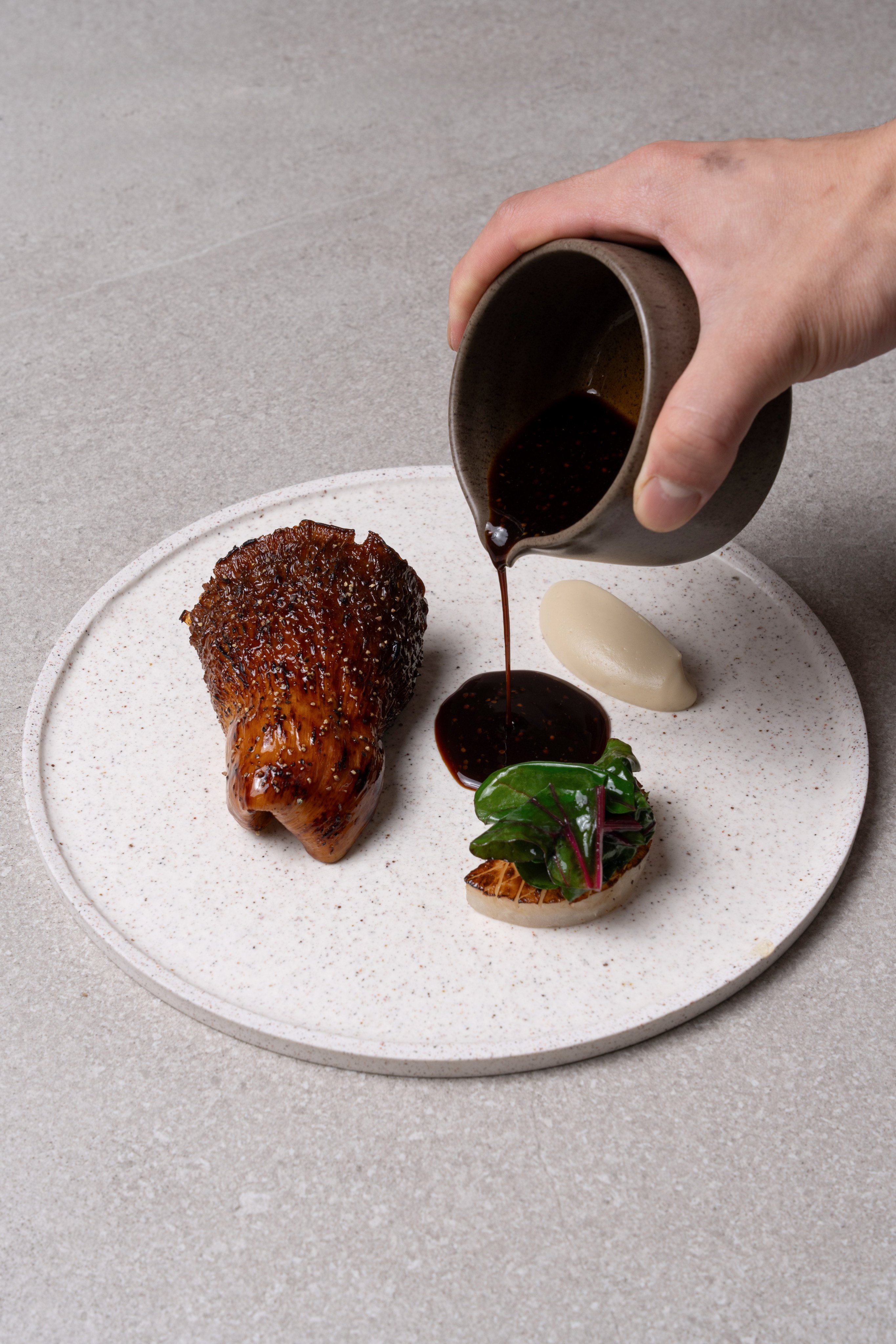 Mushroom steak with black truffle and vegetable jus at Légume in Seoul. Photo: Handout