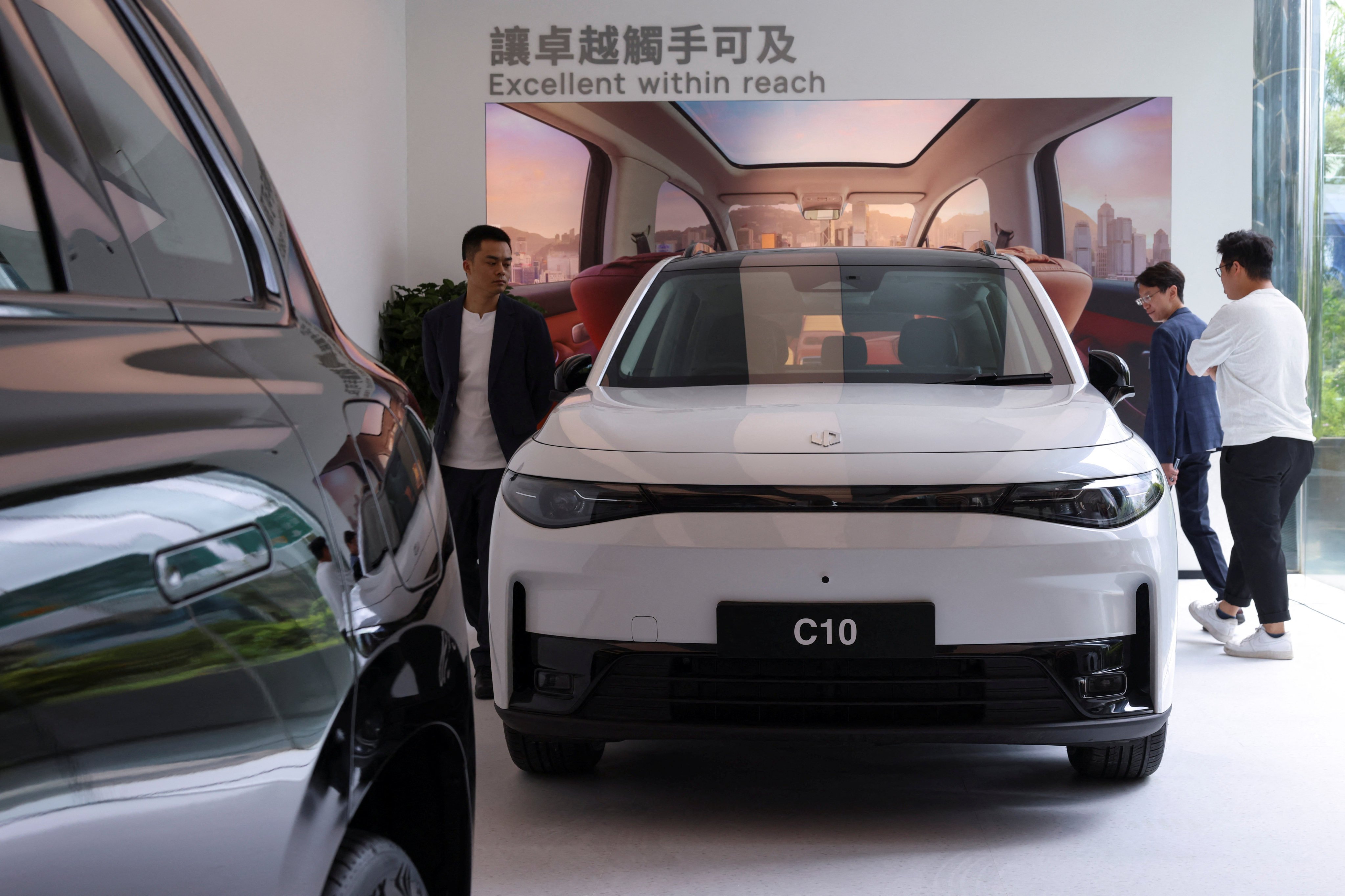 Guests view Leapmotor’s C10 electric vehicle at the opening of the company’s first showroom in Hong Kong on June 11, 2025. Photo: Reuters