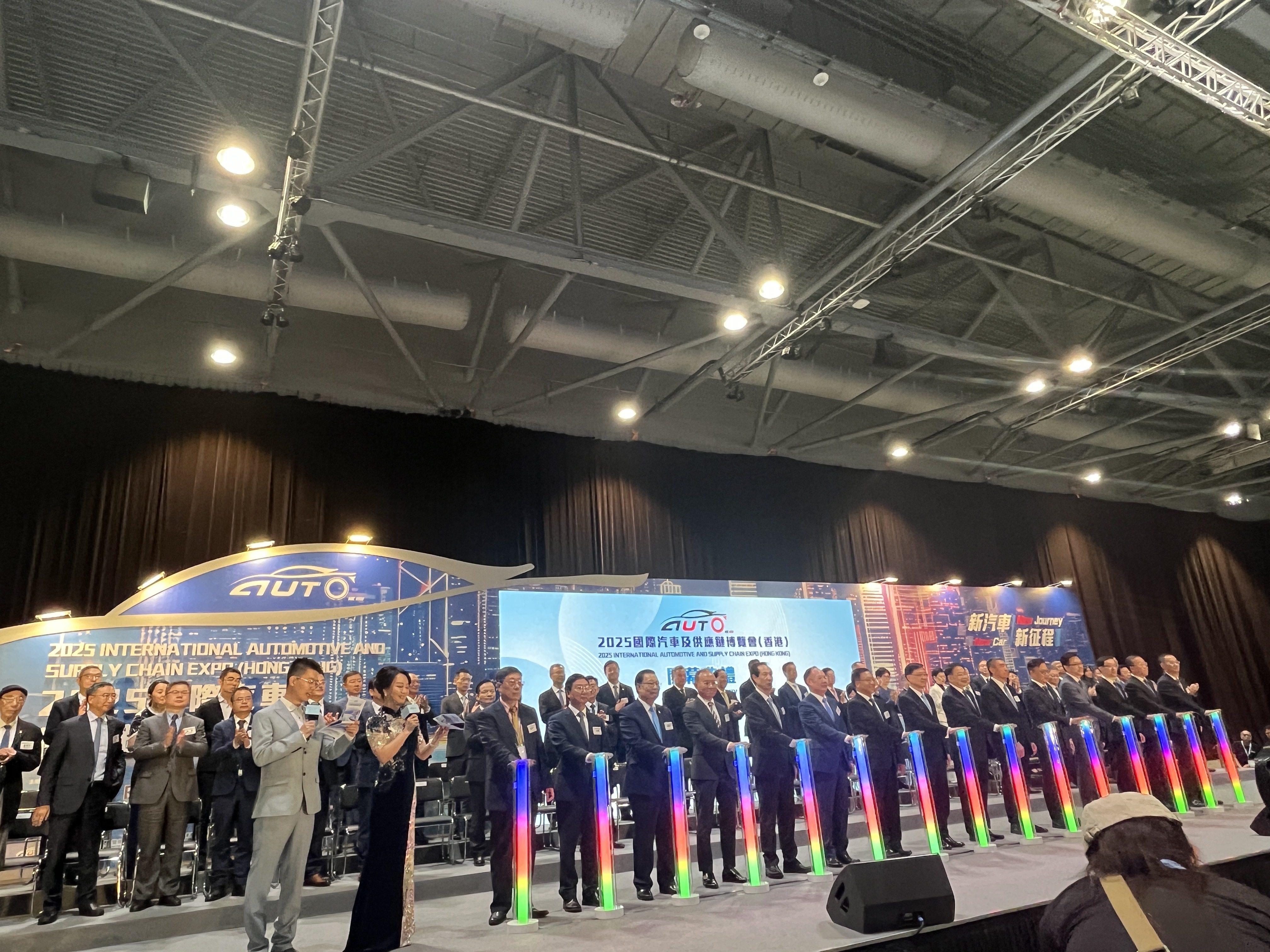Hong Kong Chief Executive John Lee Ka-chiu (eighth from the left) officiating the opening of the 2025 Hong Kong Automotive Expo at the AsiaWorld Expo on June 12, 2025. Photo: Cao Li