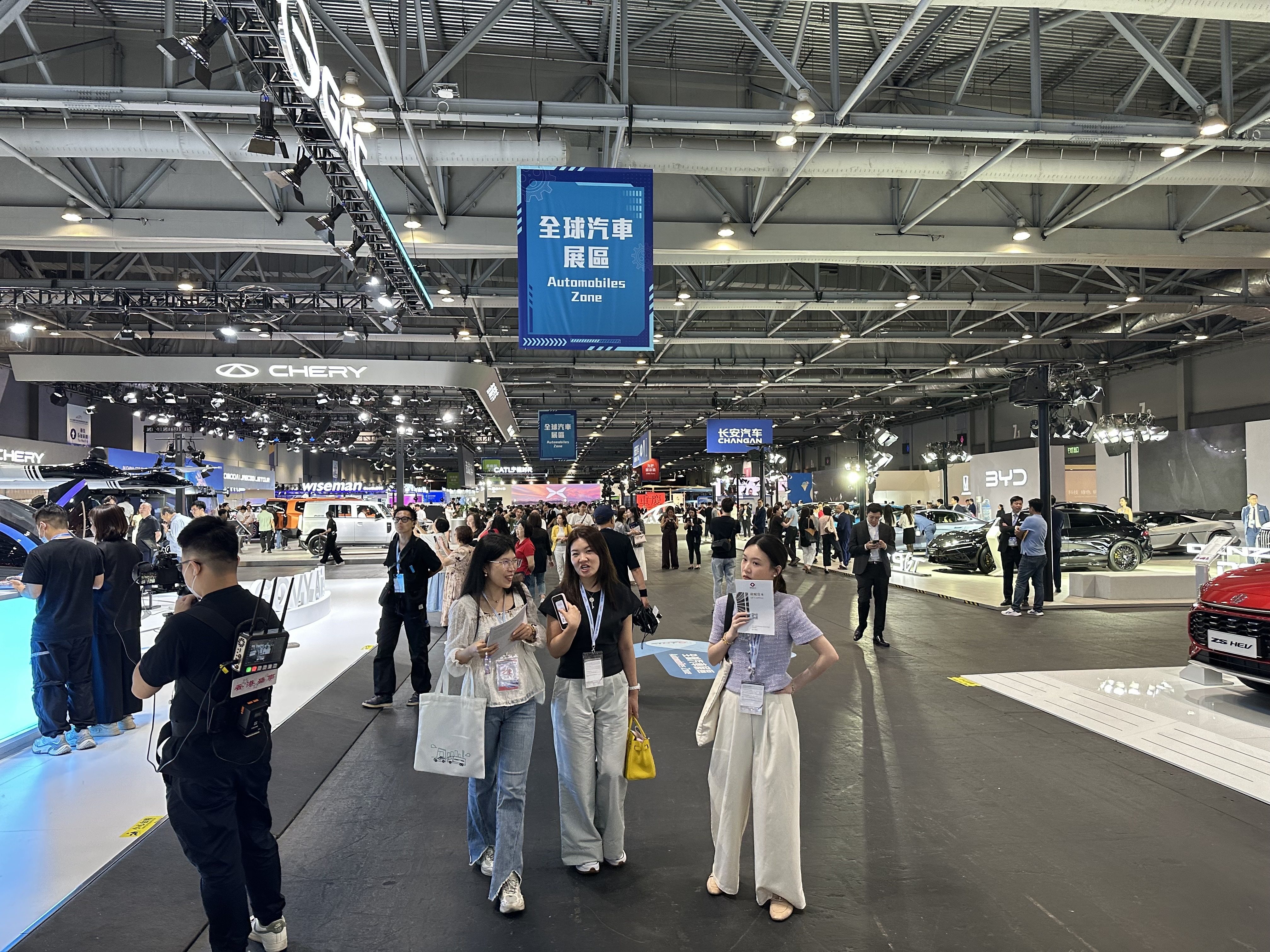 Visitors walk among Chinese electric cars at the 2025 Hong Kong Automotive Expo at Asia-World Expo on June 12, 2025. Photo: Daniel Ren