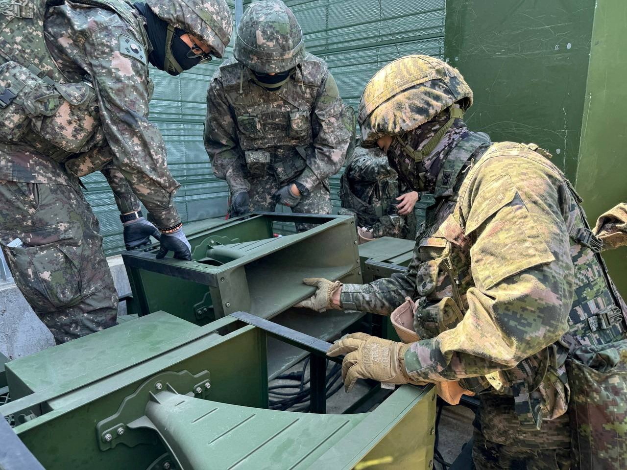 South Korean soldiers work on a loudspeaker set up for propaganda broadcasts during a military drill near the Demilitarised Zone. Photo: Handout via Reuters