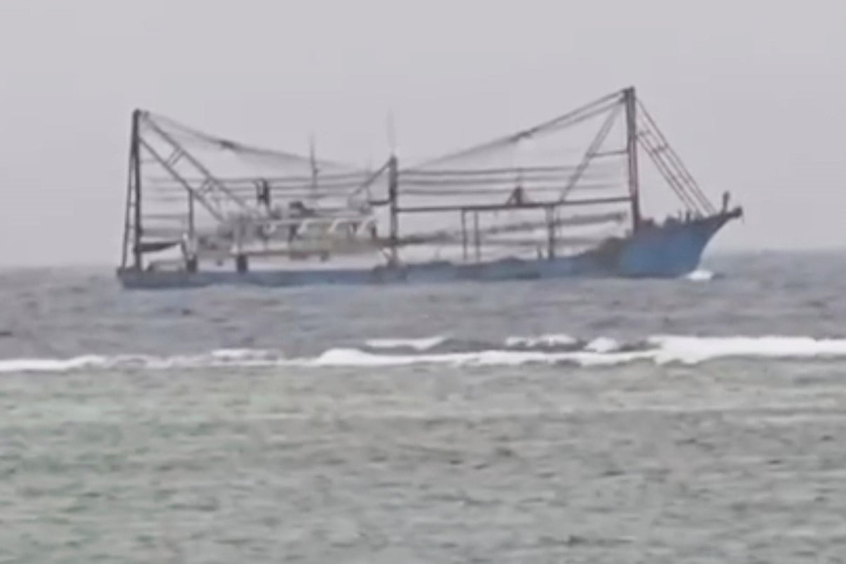 A video image shows a Chinese vessel passing through shallow waters off Philippine-occupied Thitu Island in the disputed South China Sea on June 7. Photo: Armed Forces of the Philippines, Public Affairs Office via AP