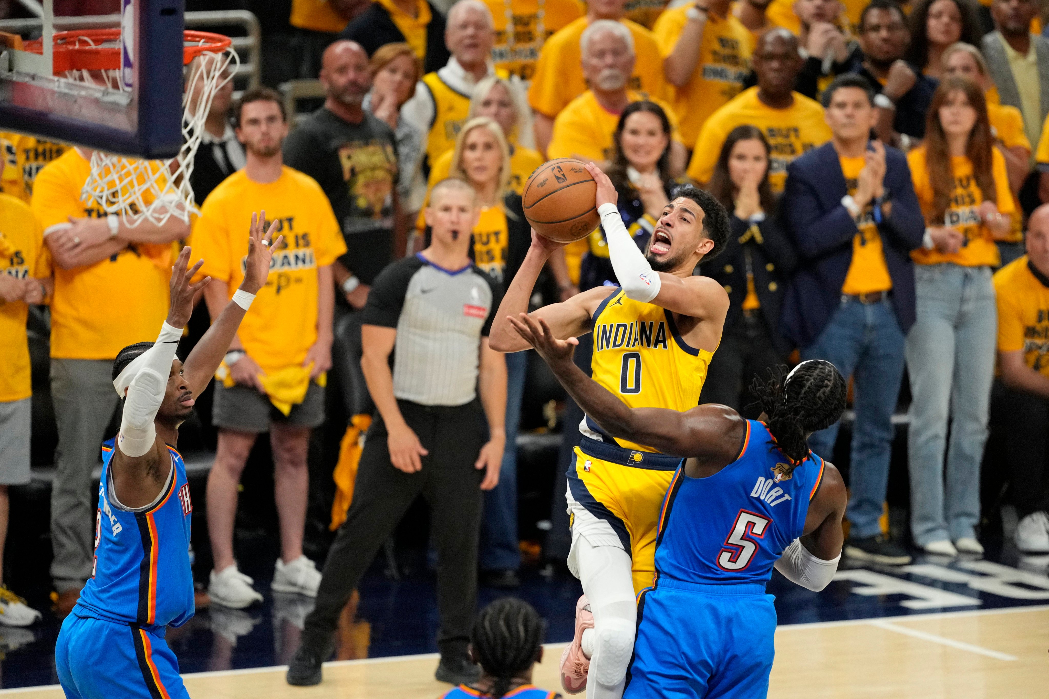 Indiana Pacers guard Tyrese Haliburton shoots with Oklahoma City Thunder’s Luguentz Dort in attendance during game three of the NBA Finals. Photo: Kyle Terada-Imagn Images