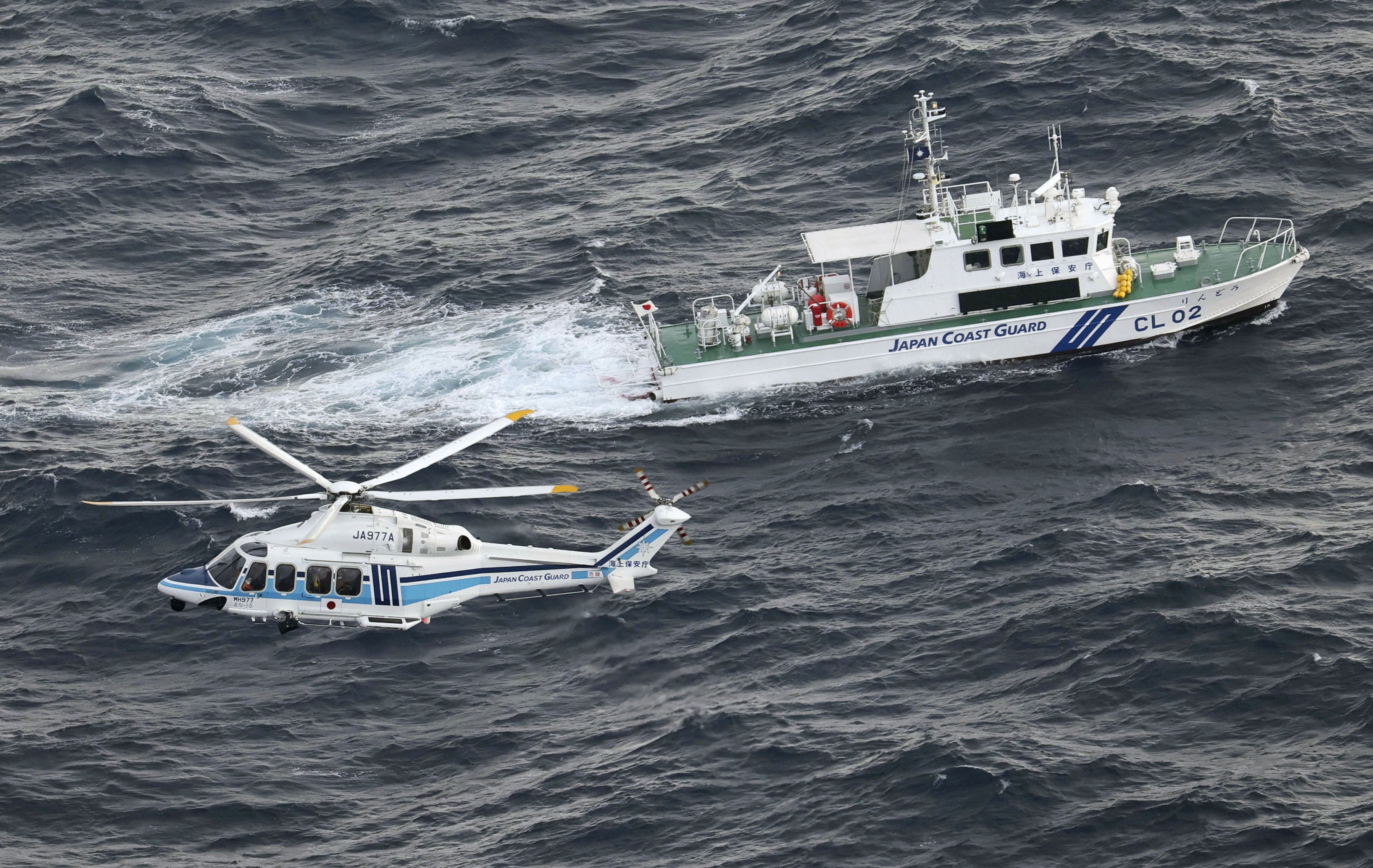 A Japan coastguard patrol ship and helicopter during an operation in southwestern Japan. Photo: Kyodo
