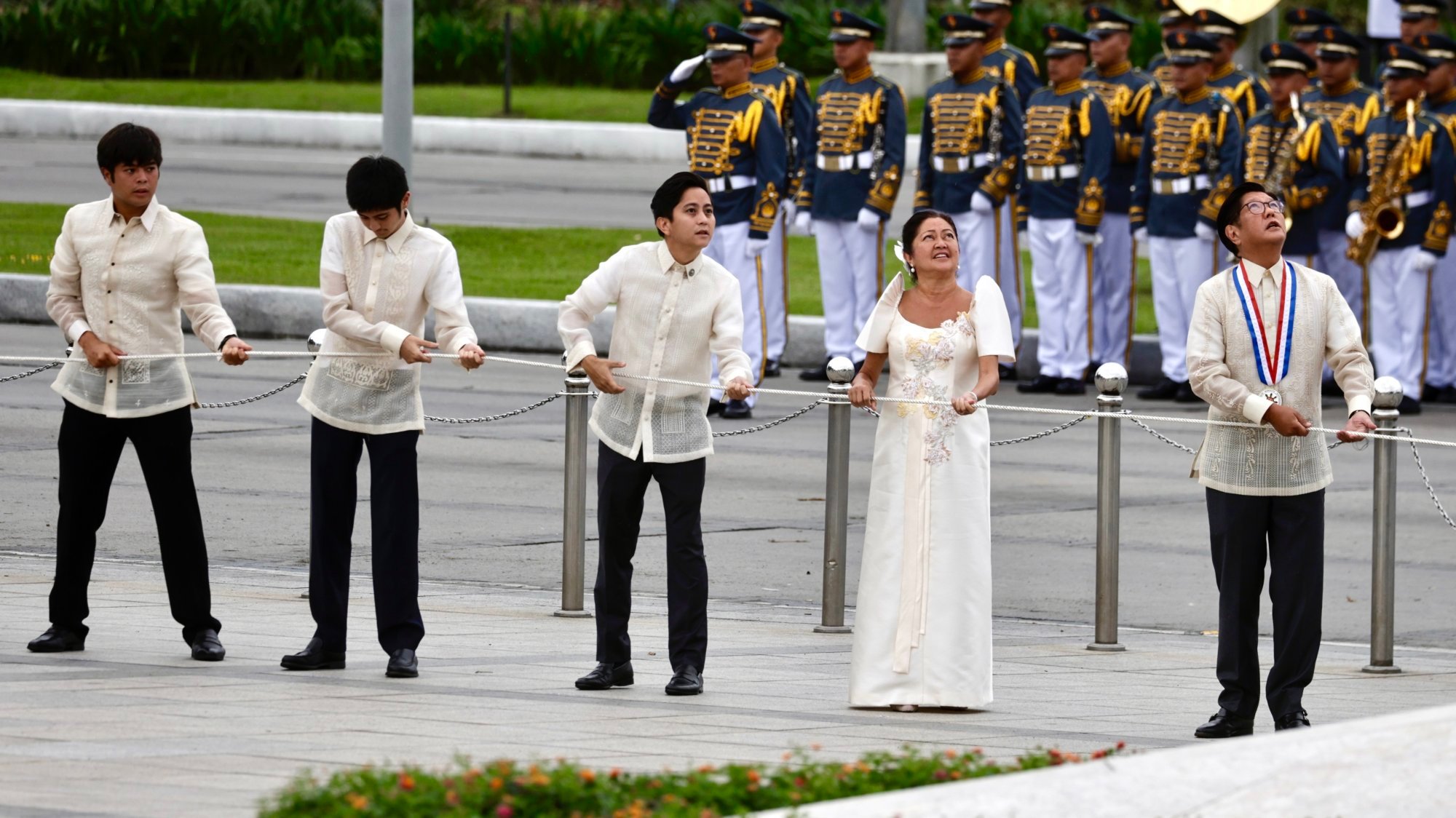 Marcos (right) and his family lead Independence Day flag-raising and wreath-laying rites at the Jose Rizal monument on Thursday. Photo: EPA-EFE Marcos (right) and his family lead Independence Day flag-raising and wreath-laying rites at the Jose Rizal monument on Thursday. Photo: EPA-EFE