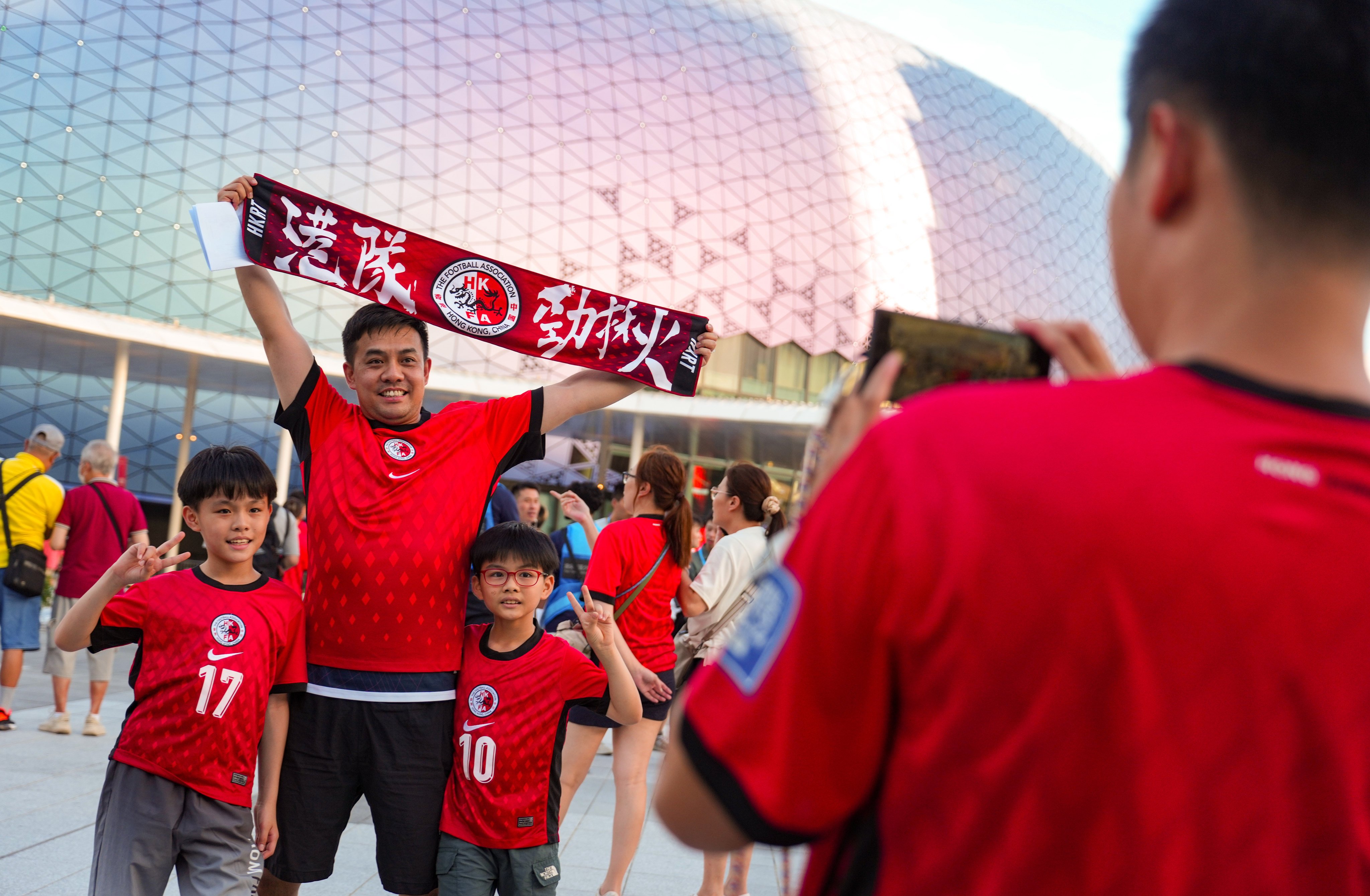Hong Kong football fans enjoy their team’s first match at Kai Tak Stadium on Tuesday. Photo: Sam Tsang
