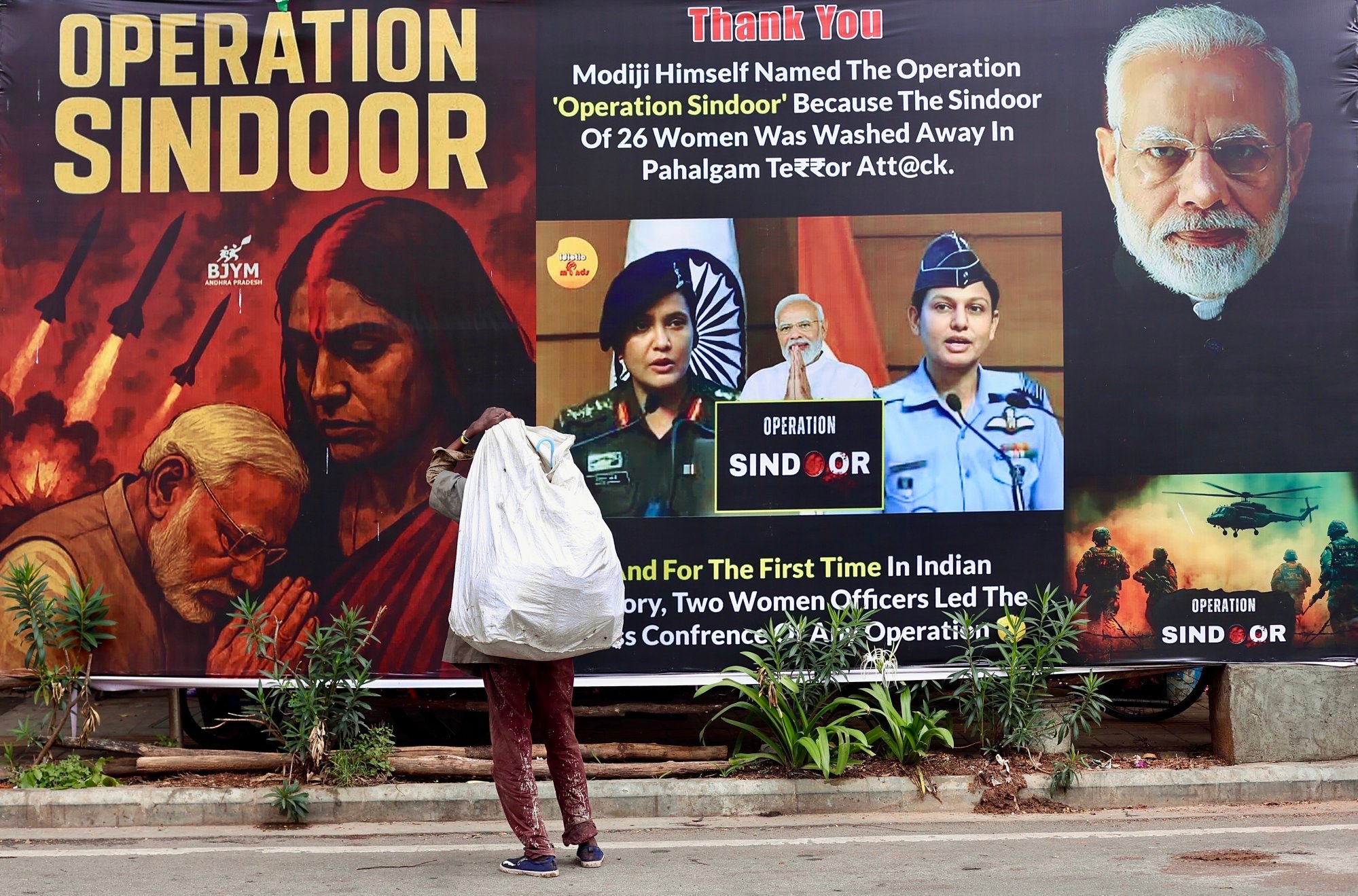 A person stands in front of a billboard reading “Operation Sindoor”, a code name for a military campaign carried out by India across Pakistan, in Bengaluru on May 21. Photo: EPA-EFE A person stands in front of a billboard reading “Operation Sindoor”, a code name for a military campaign carried out by India across Pakistan, in Bengaluru on May 21. Photo: EPA-EFE