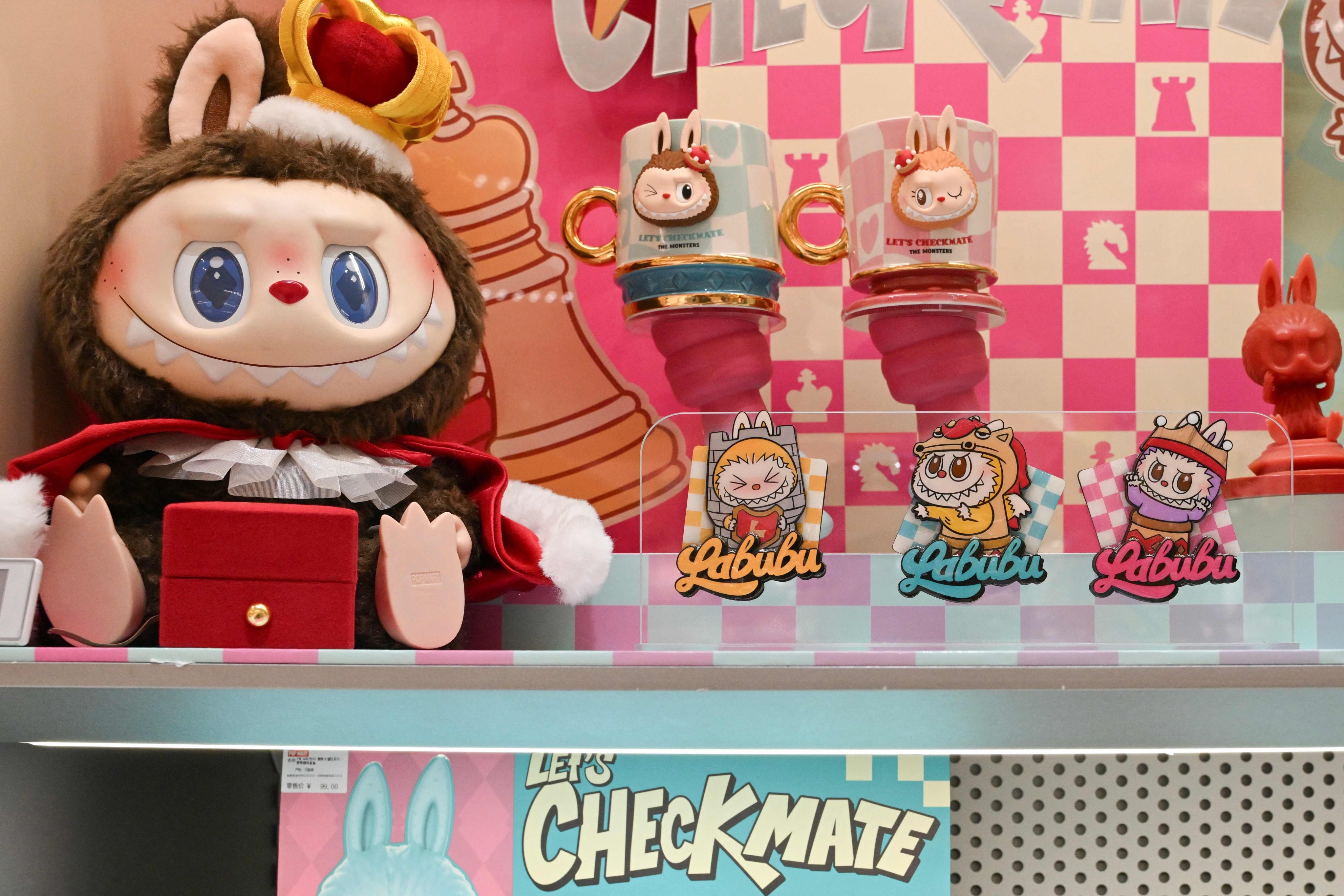 Labubu figures and stickers are seen at a Pop Mart shop in Beijing on June 12, 2025. Photo: AFP
