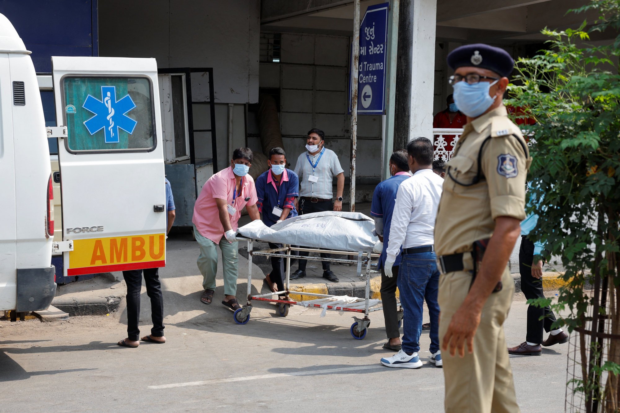 The body of a victim, who died in the Air India Boeing 787-8 Dreamliner crash, being brought to a hospital. Photo: Reuters The body of a victim, who died in the Air India Boeing 787-8 Dreamliner crash, being brought to a hospital. Photo: Reuters
