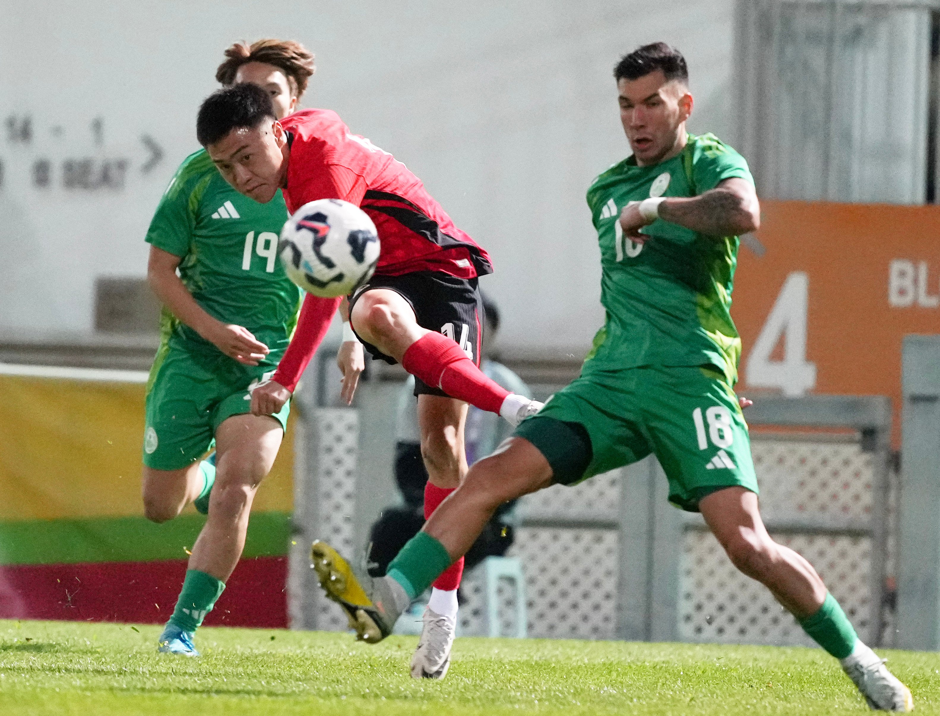 Hong Kong’s Jesse Yu Joy-yin (red shirt) takes on Macau when the teams met in March. Photo: Sam Tsang