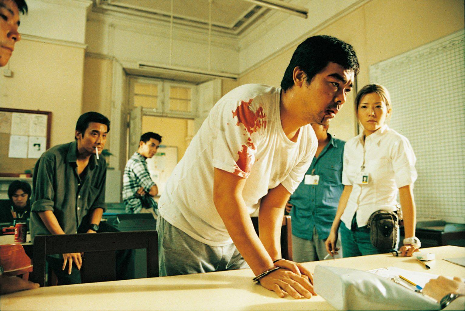 Lau Ching-wan (front) in a still from Victim.