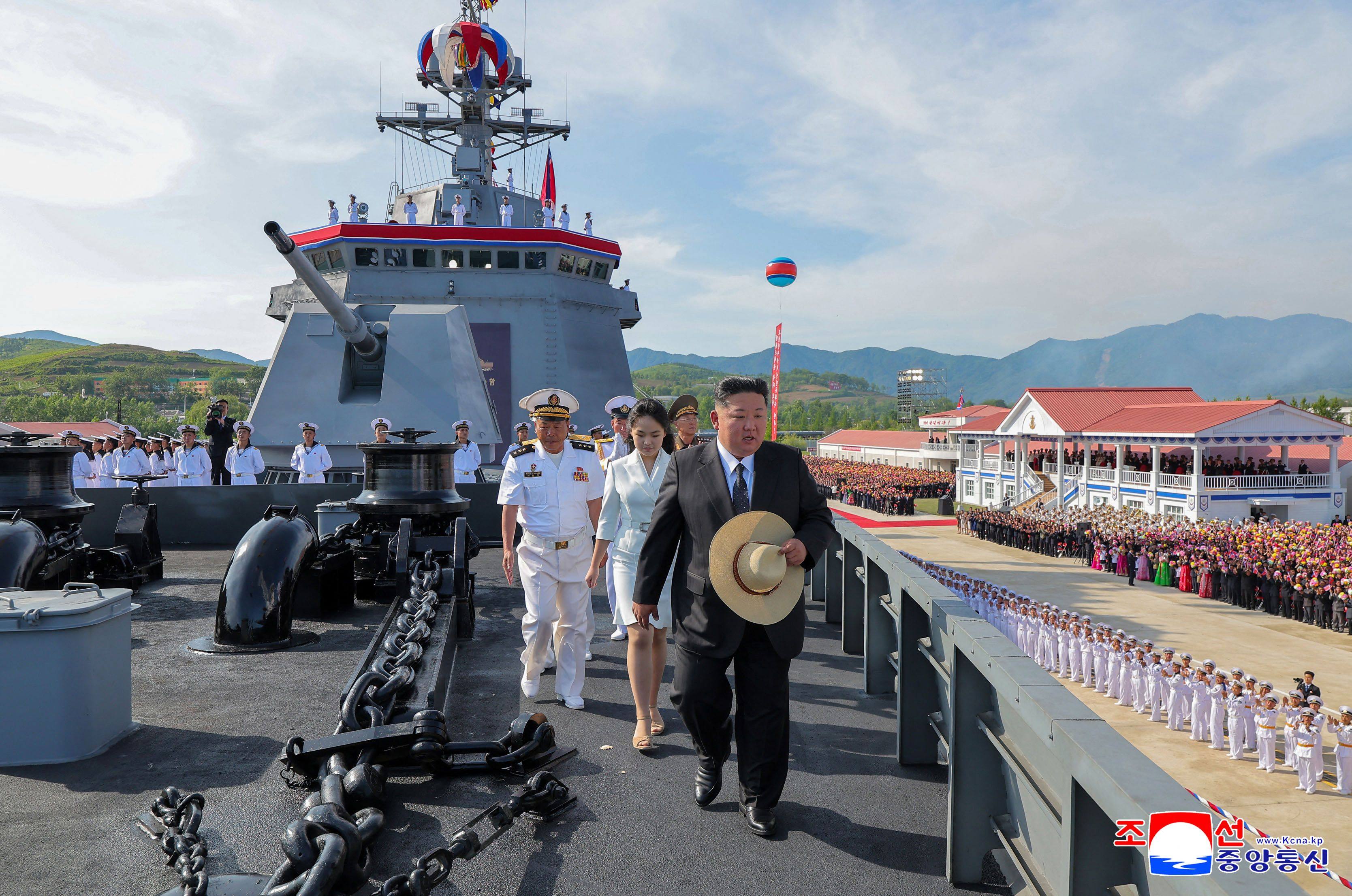 North Korea’s leader Kim Jong-un (centre) and daughter Ju-ae on  board the destroyer Kang Kon on Thursday. Photo: KCNA/KNS/AFP