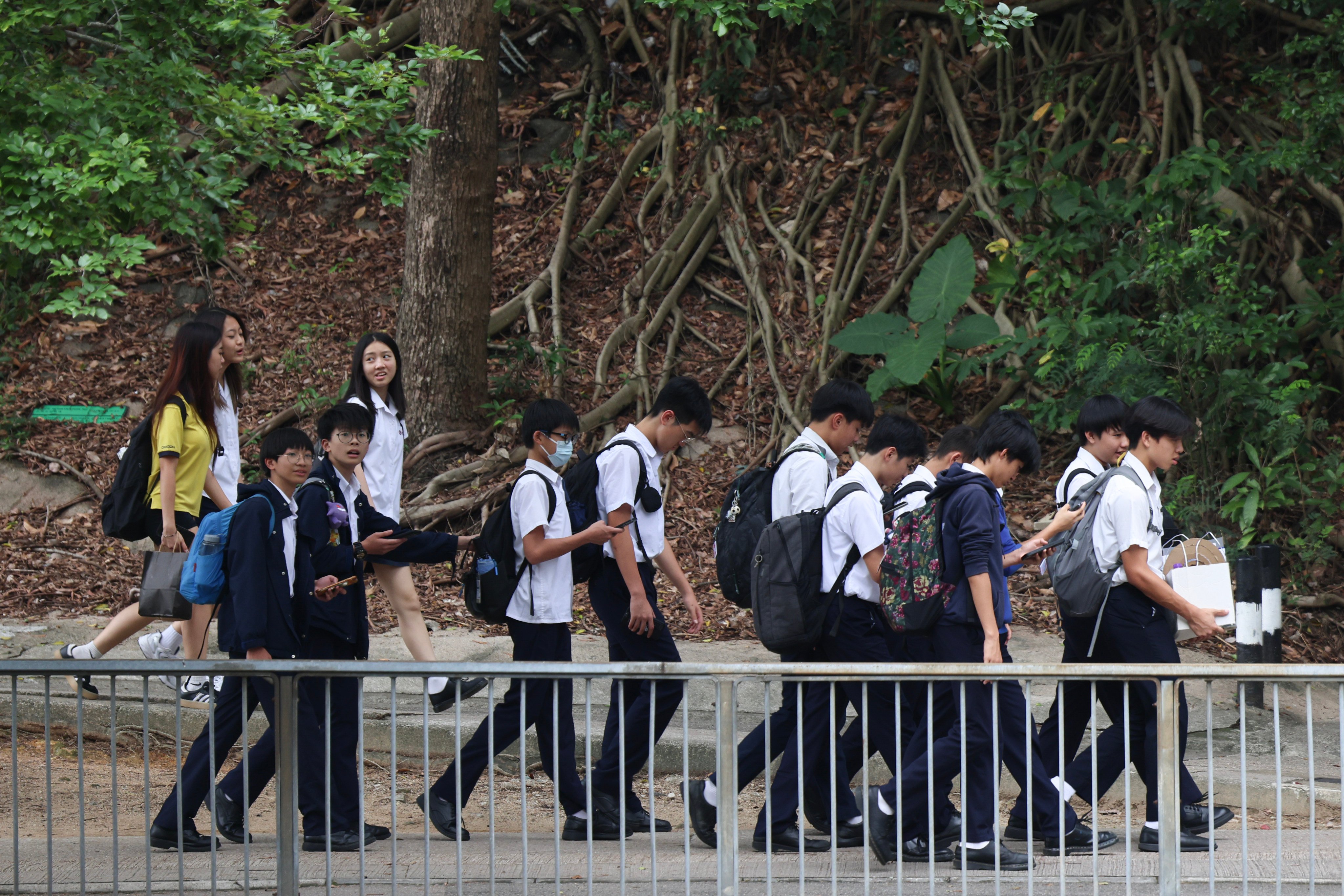 Secondary school students walk along a footpath in Fo Tan. Photo: Jelly Tse
