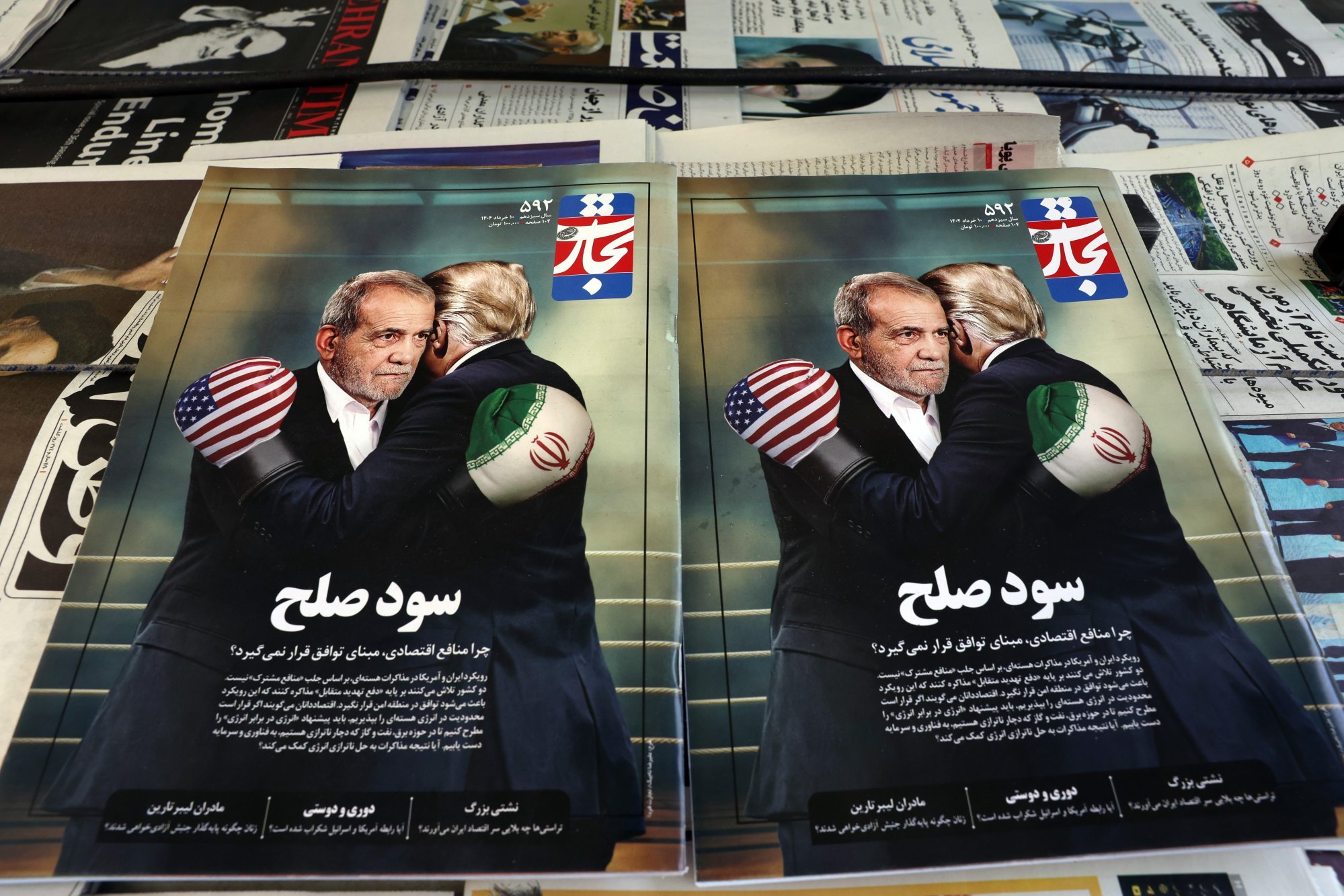 Copies of the Iranian magazine Tejarat Farda, titled “The benefit of peace”, features an image of Iranian President Masoud Pezeshkian and US President Donald Trump embracing while wearing boxing gloves at a kiosk in Tehran. Iran has insisted its nuclear activities are entirely peaceful. Photo: EPA-EFE Copies of the Iranian magazine Tejarat Farda, titled “The benefit of peace”, features an image of Iranian President Masoud Pezeshkian and US President Donald Trump embracing while wearing boxing gloves at a kiosk in Tehran. Iran has insisted its nuclear activities are entirely peaceful. Photo: EPA-EFE