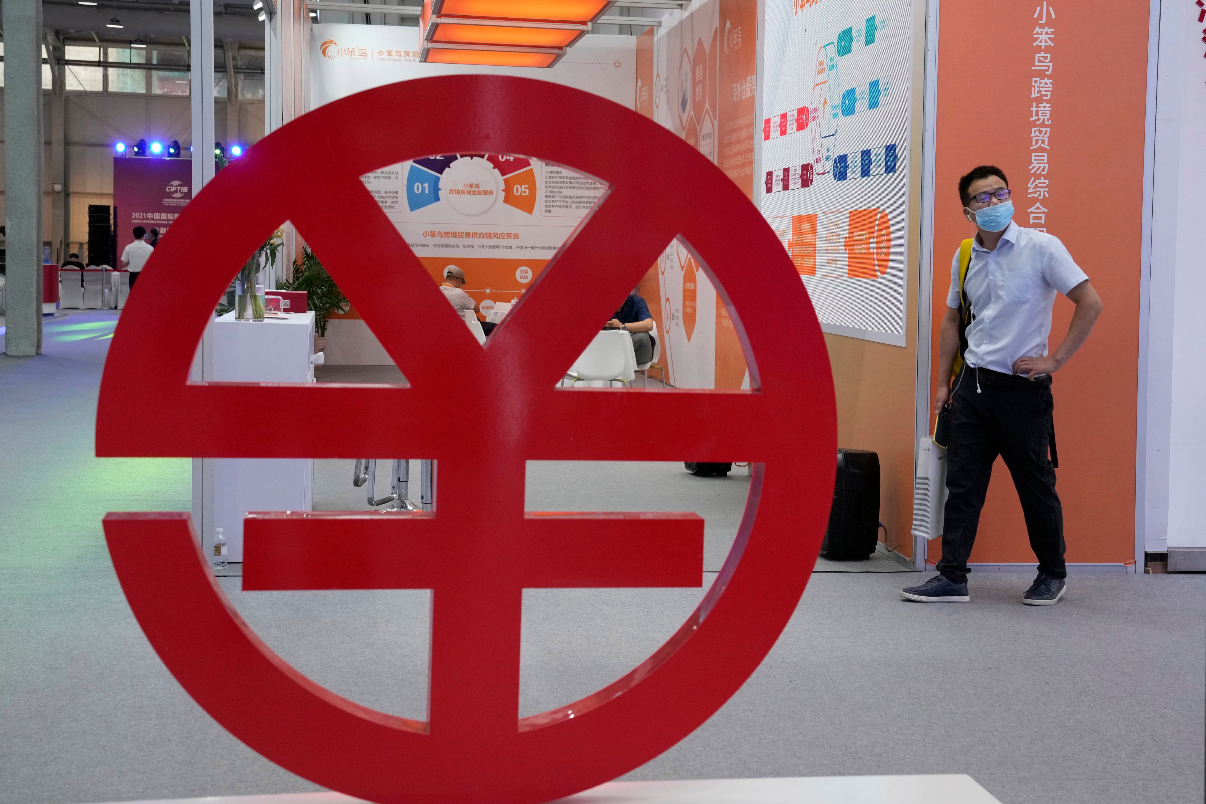 An e-CNY logo at the China International Fair for Trade in Services (CIFTIS) in Beijing in 2021. A well-regulated yuan stablecoin issued from Hong Kong could serve as a strategic tool for China’s yuan internationalisation efforts. Photo: AP
