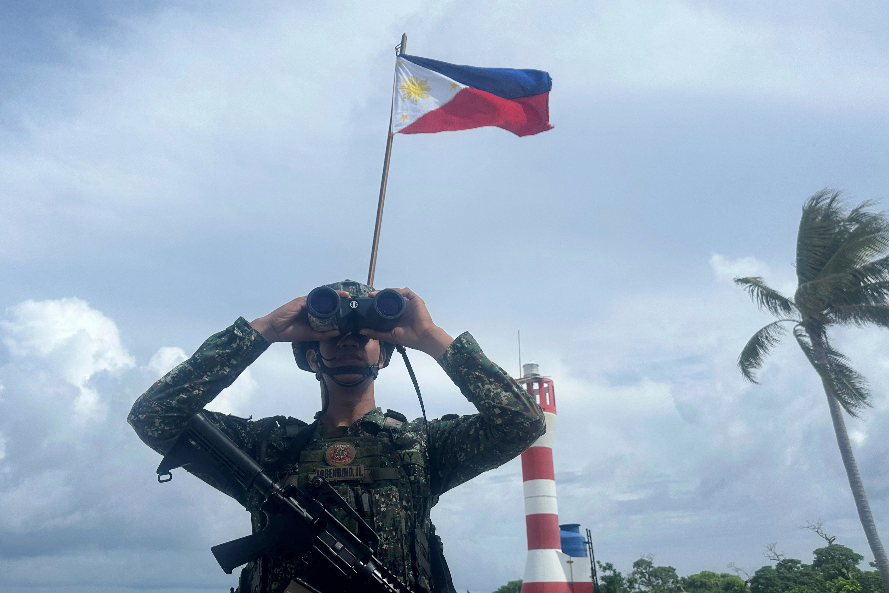 A Philippine marine stands guard at West York Island, locally called Likas Island, one of the Philippine-occupied islands in the South China Sea. Photo: AP