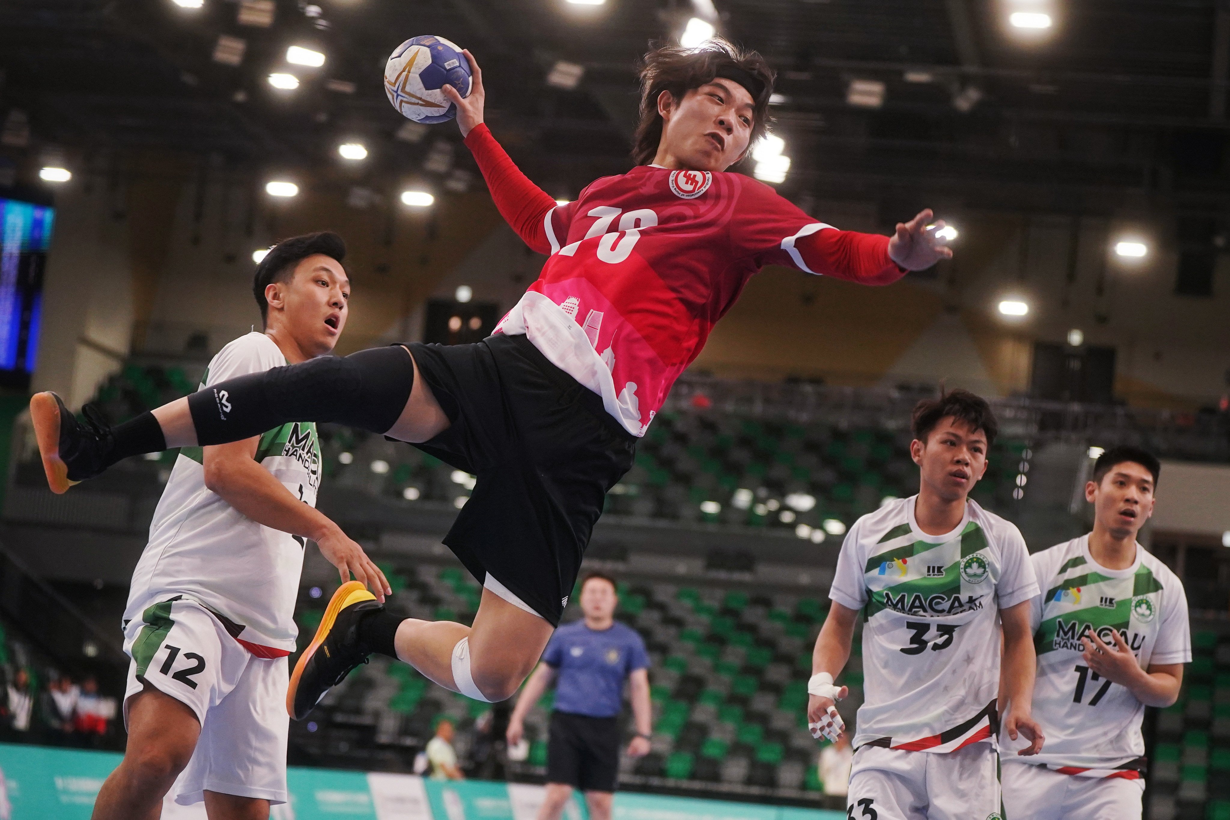 Hong Kong’s Kan Yik-man scores in the National Games Men Handball Test Event in February. Photo: Elson Li