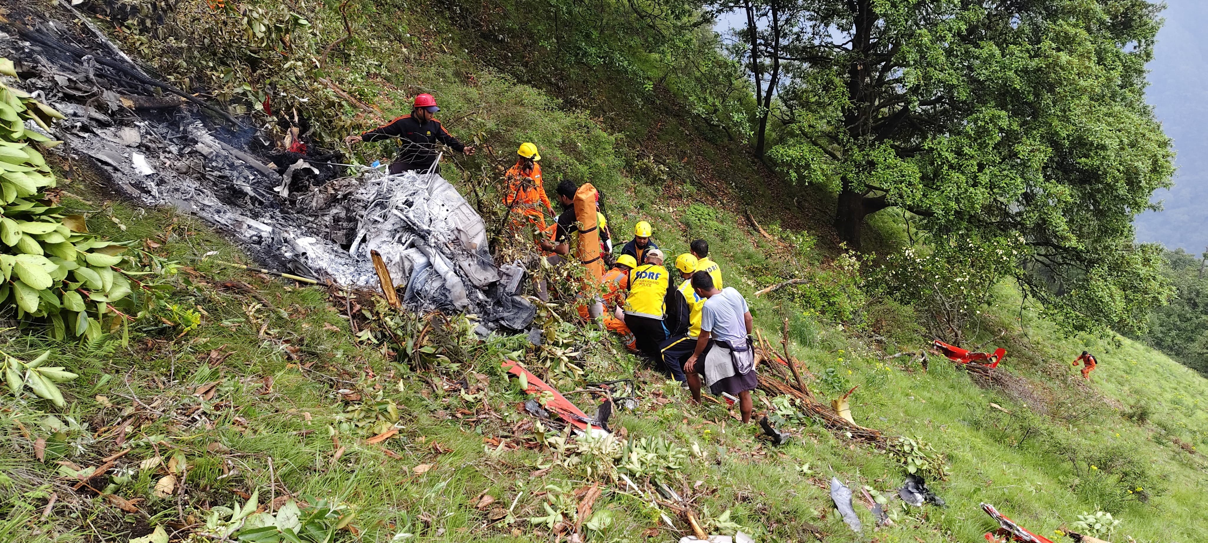 Members of rescue teams work at the site of a helicopter crash in the Gaurikund area of the northern Indian state of Uttarakhand, India, on Sunday. Photo: Reuters
