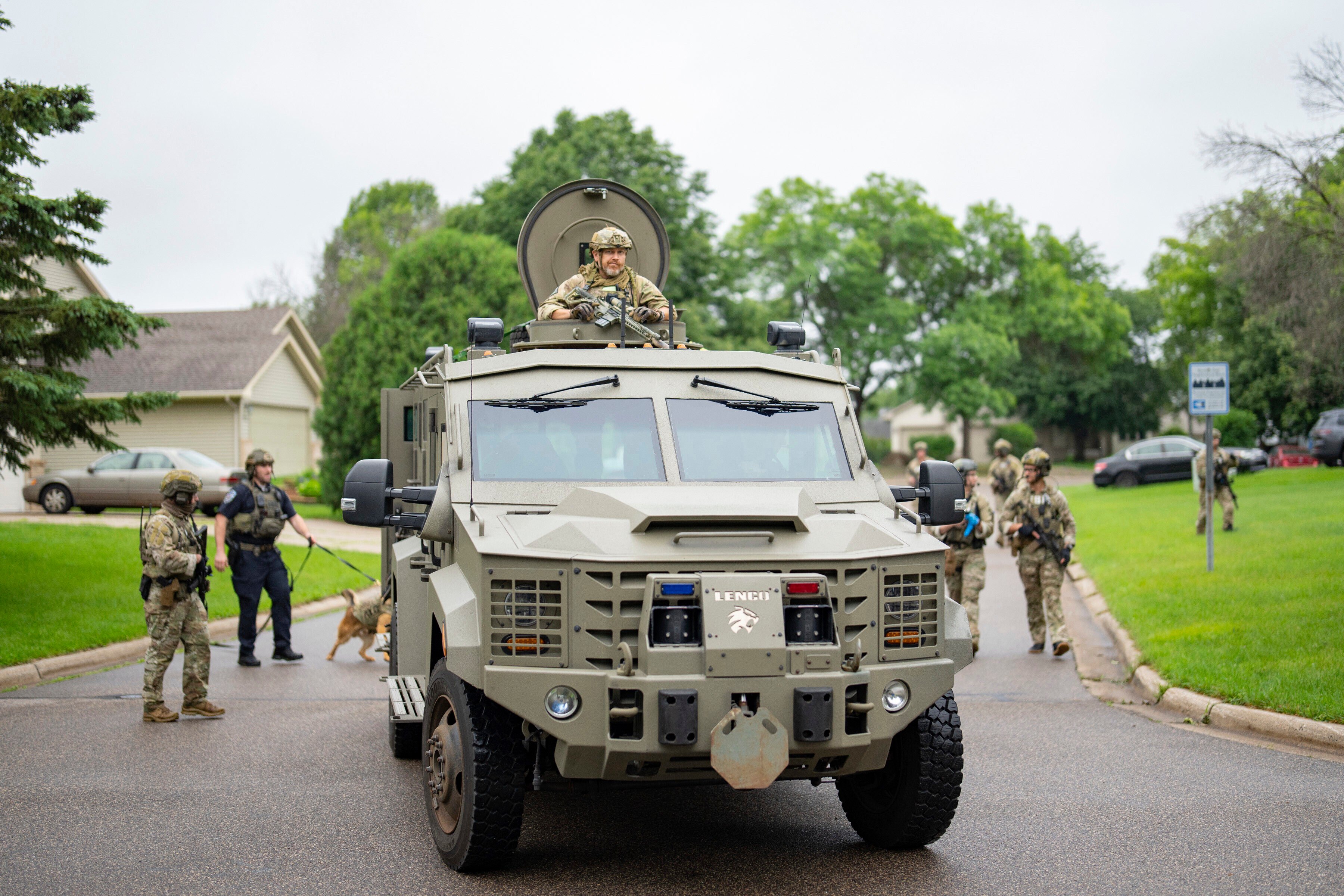 Armed FBI agents sweep a neighbourhood adjacent to the home of lawmaker Melissa Hortman in Brooklyn Park, Minnesota, on June 14. Photo: Star Tribune via AP
