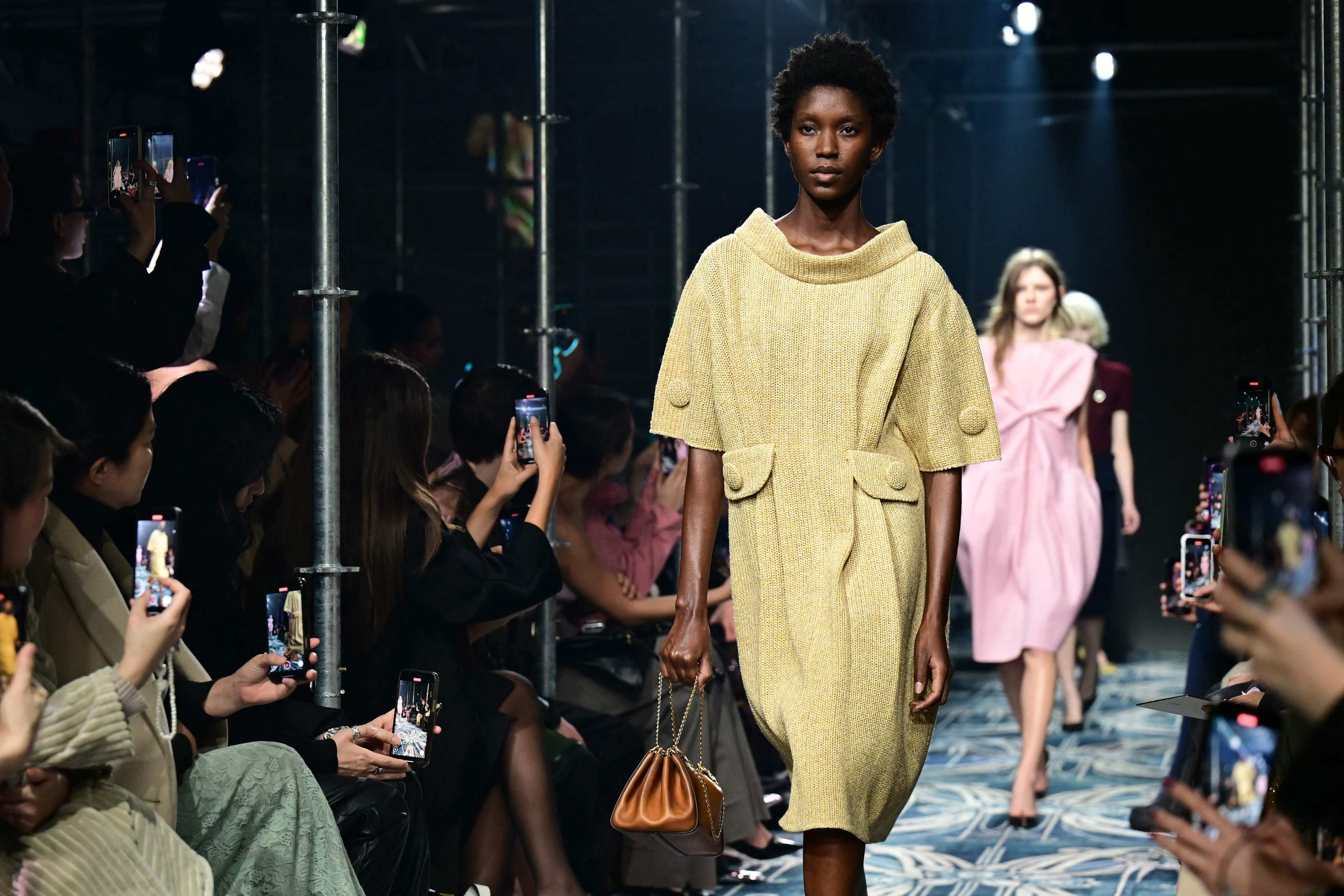 Chanel and Prada are among the big-name brands celebrating the humble button in recent collections, as seen here on Prada’s ready-to-wear fall/winter 2025-26 runway, at Milan Fashion Week in February. Photo: AFP