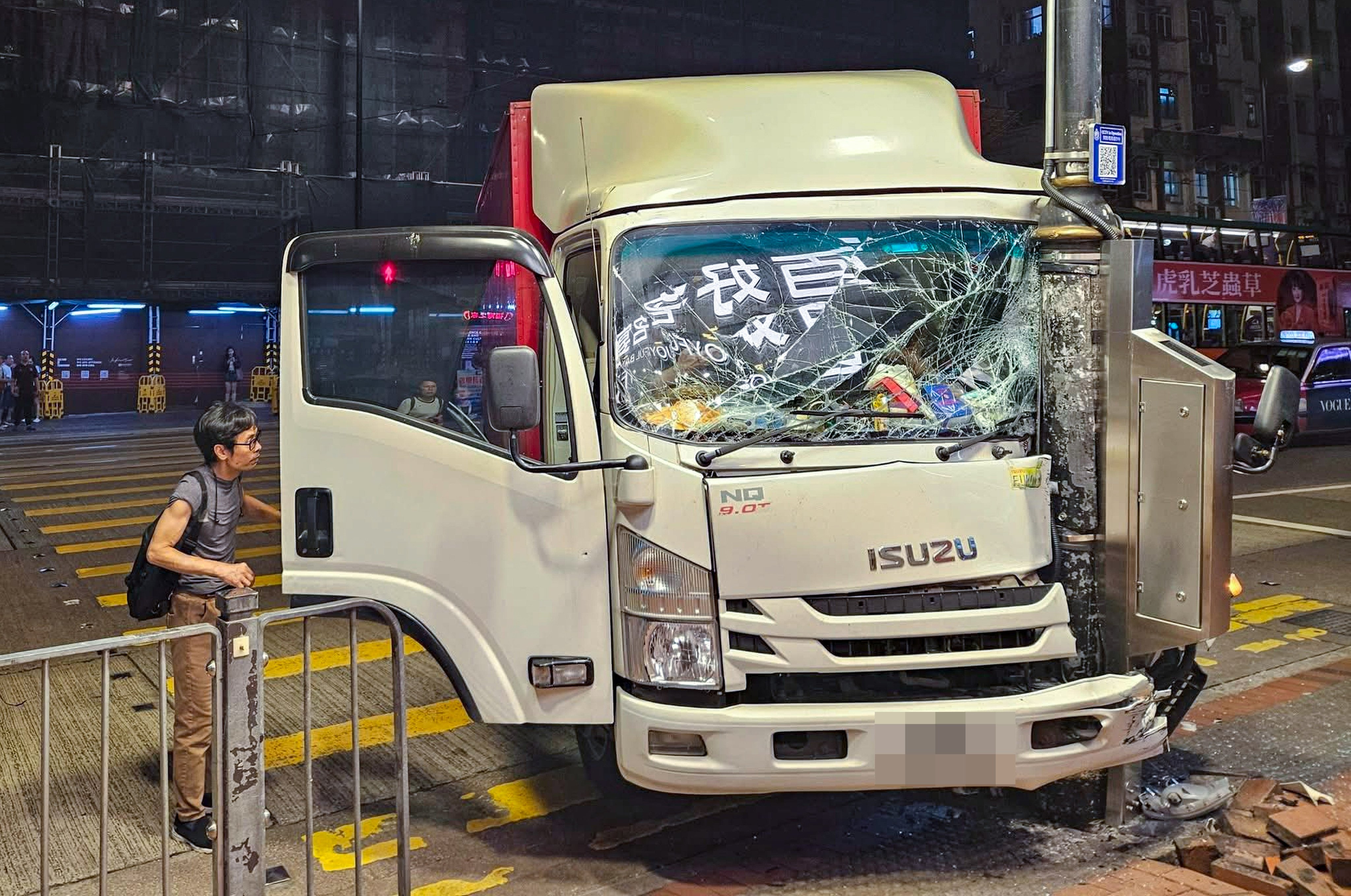 Hong Kong police have arrested a man on suspicion of dangerous driving after his truck rolled forward and crashed into a lamp post. Photo: Handout