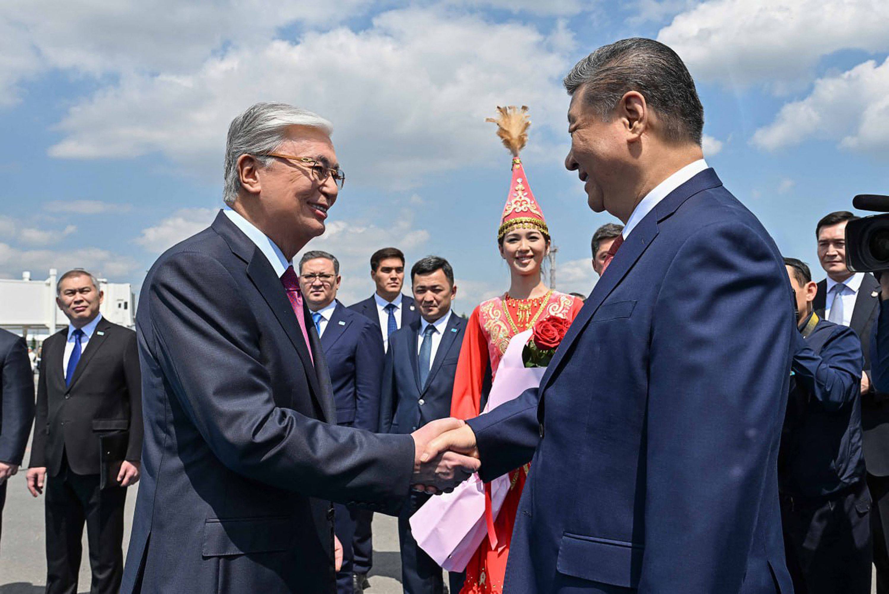 Kazakh President Kassym-Jomart Tokayev (left) greets Chinese President Xi Jinping as he arrives in in Astana for the second China-Central Asia Summit.  Photo: AFP